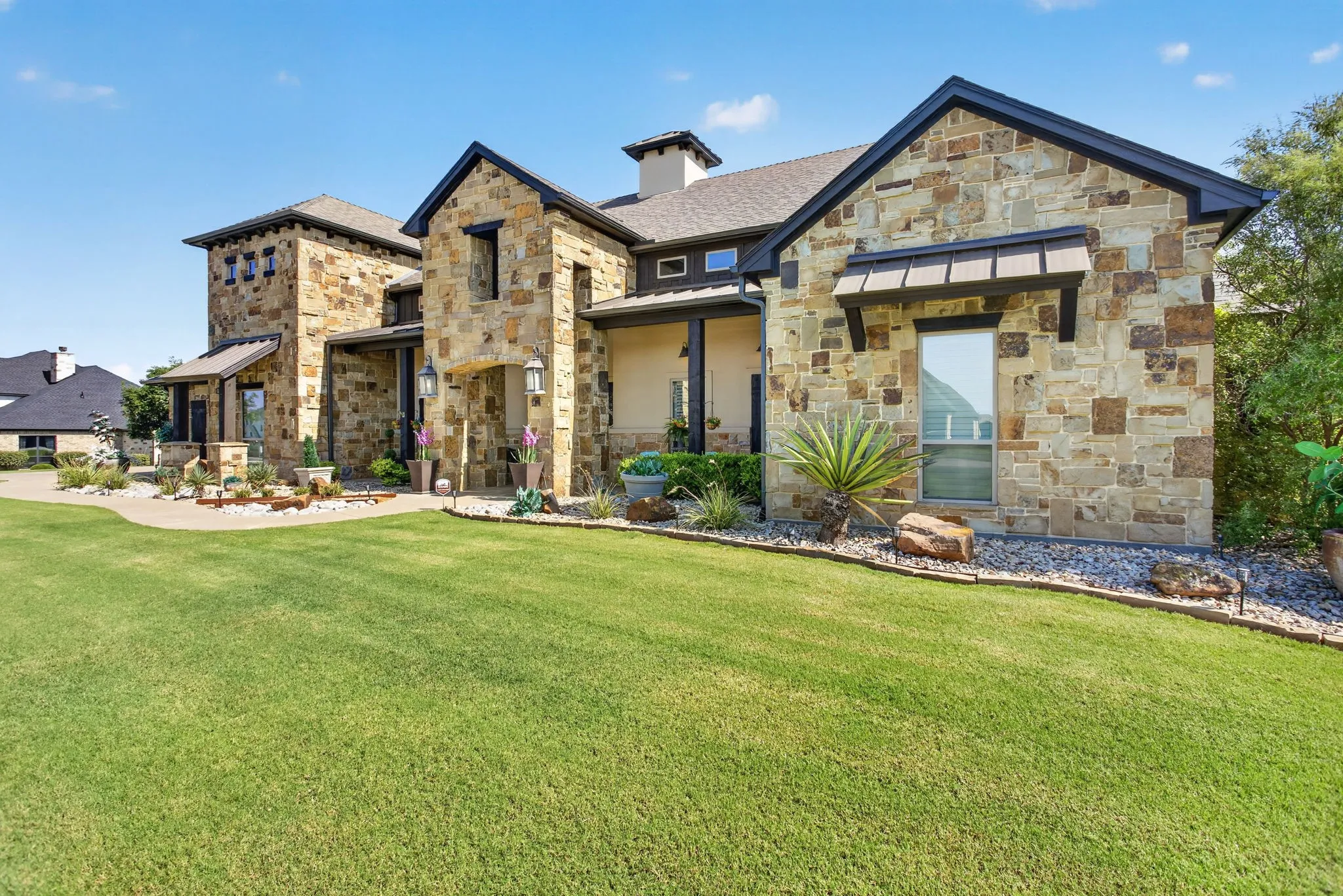 Stone-clad exterior featuring multiple architectural elements
