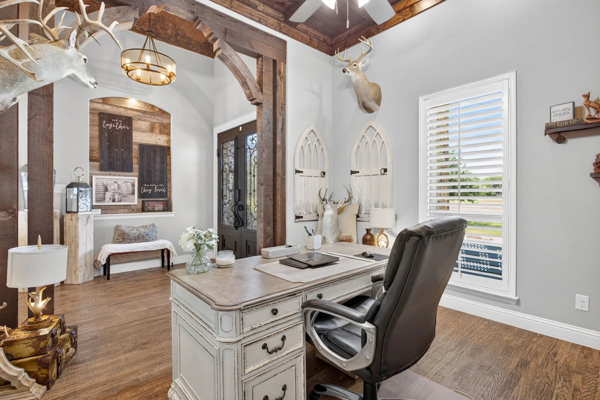 Home office with wood-finish flooring and a wood-paneled ceiling