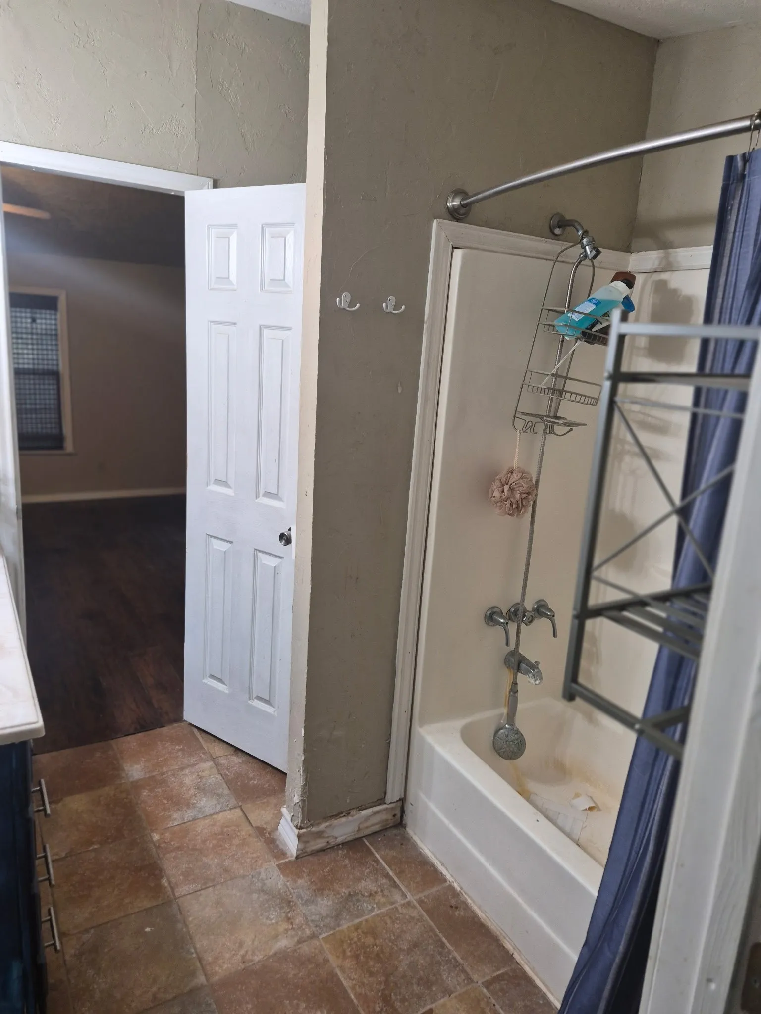 White bathtub with a chrome shower fixture