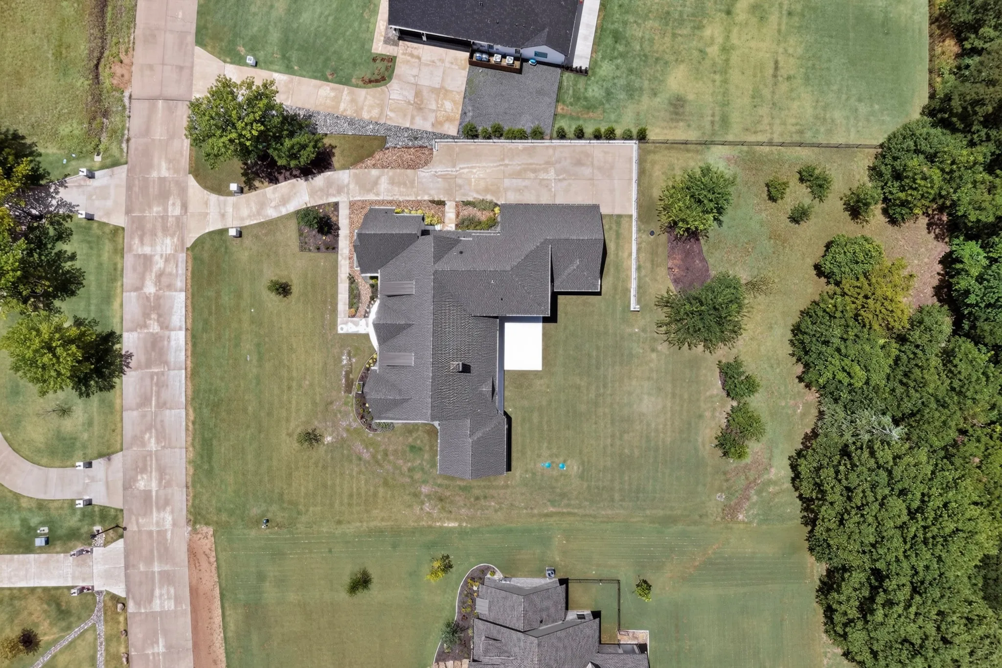 Aerial perspective showcasing a sprawling property with extensive green space