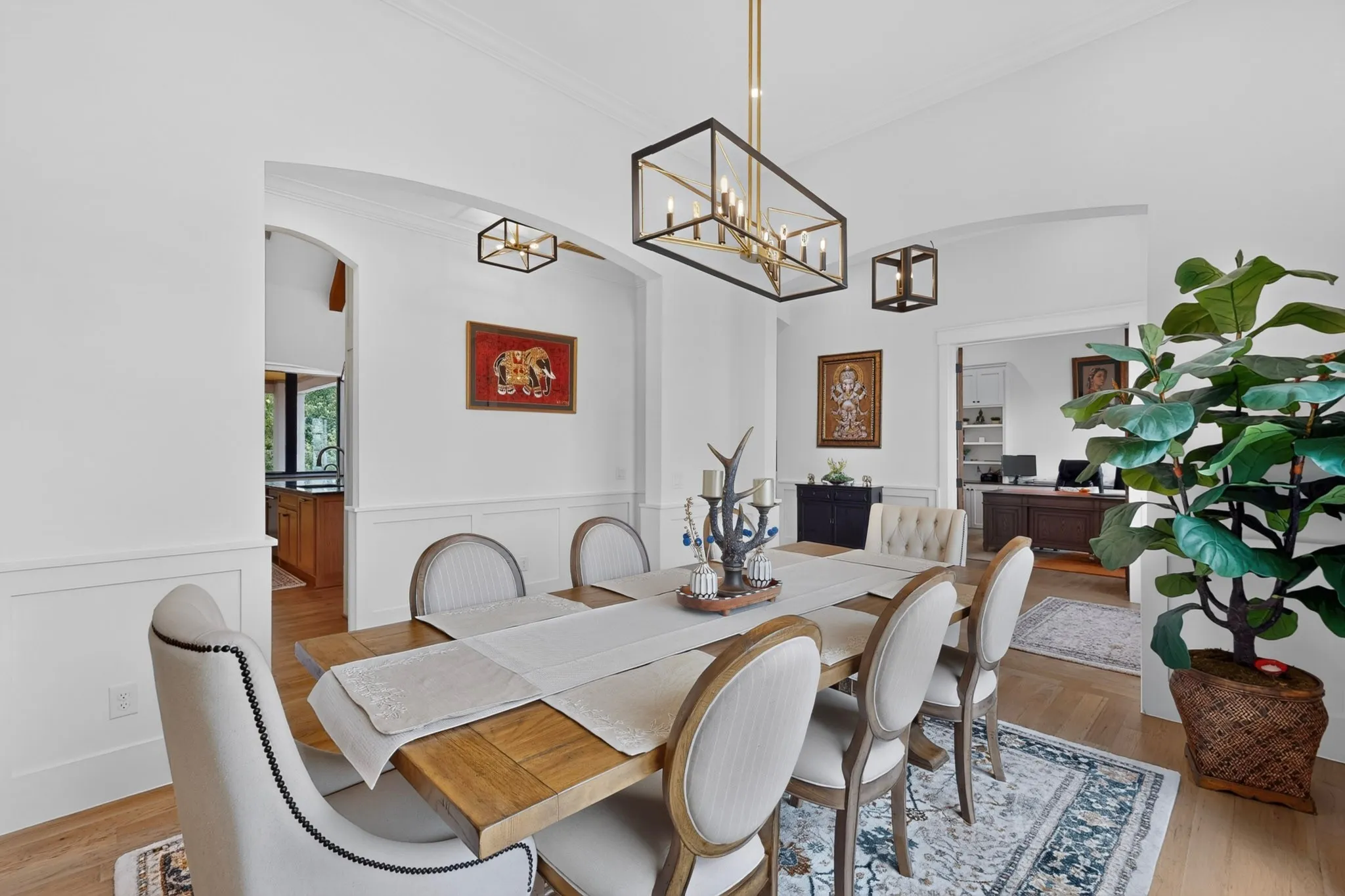 Formal dining room featuring wainscoting and crown molding