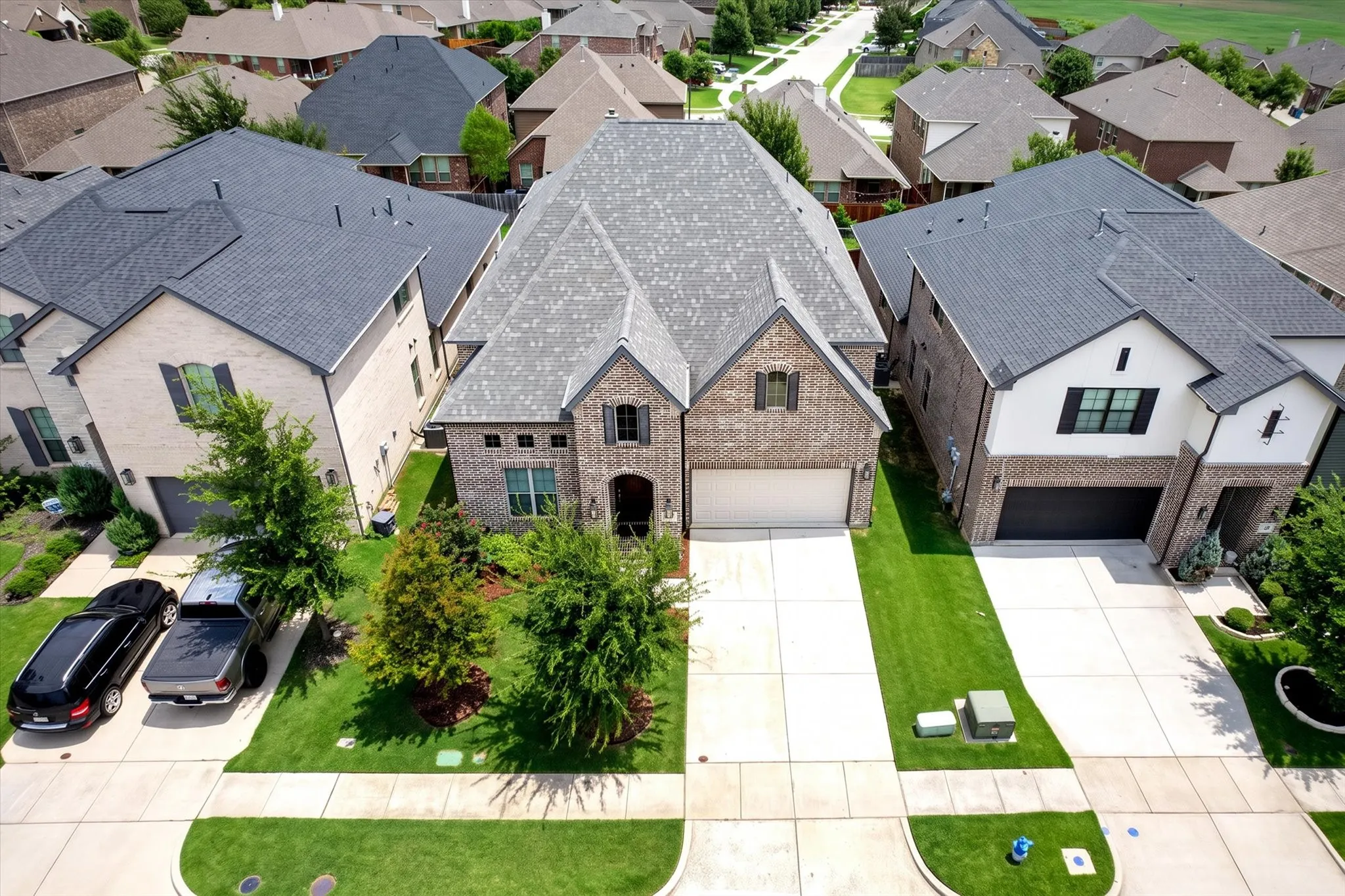 Brick and stone veneer exterior featuring a gabled roofline