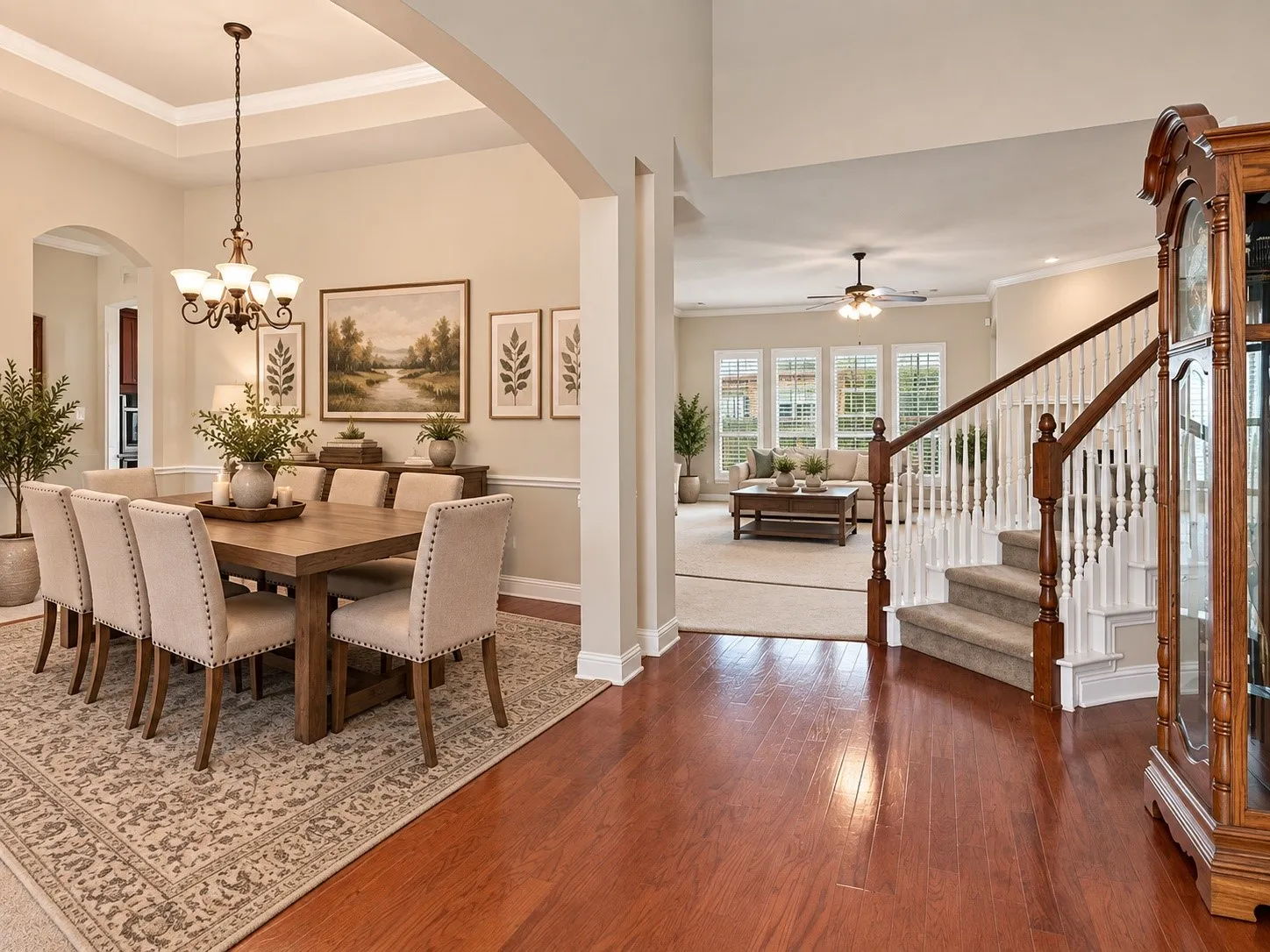 AI Generated Tray ceiling with chandelier, hardwood flooring, carpeted staircase with white balusters, and multiple windows with plantation shutters