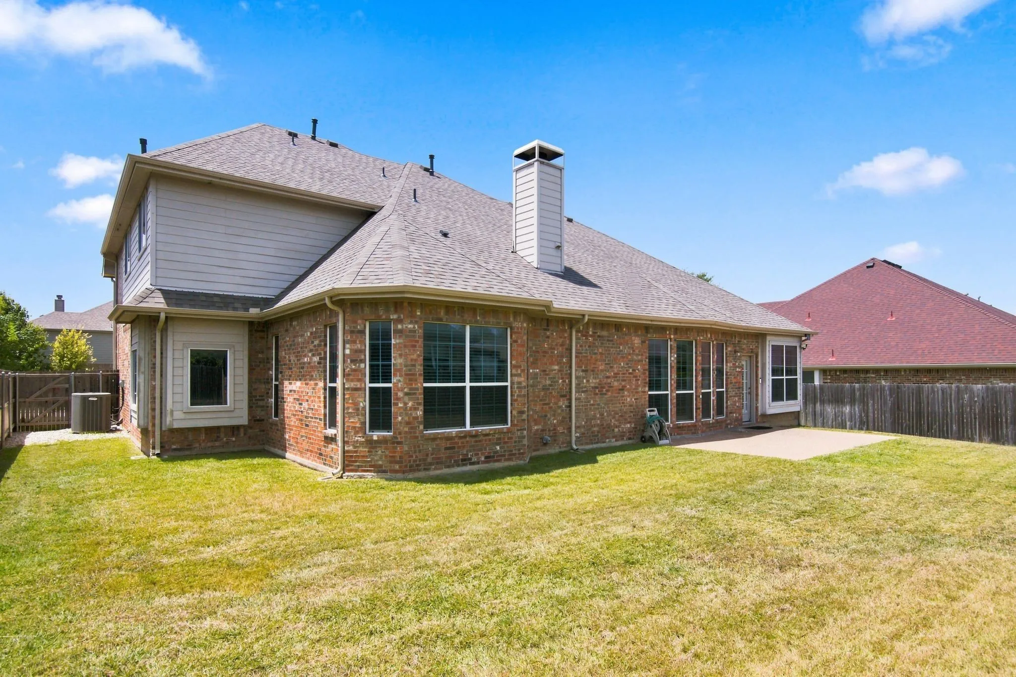 Brick exterior with a gabled roof and a second-story dormer
