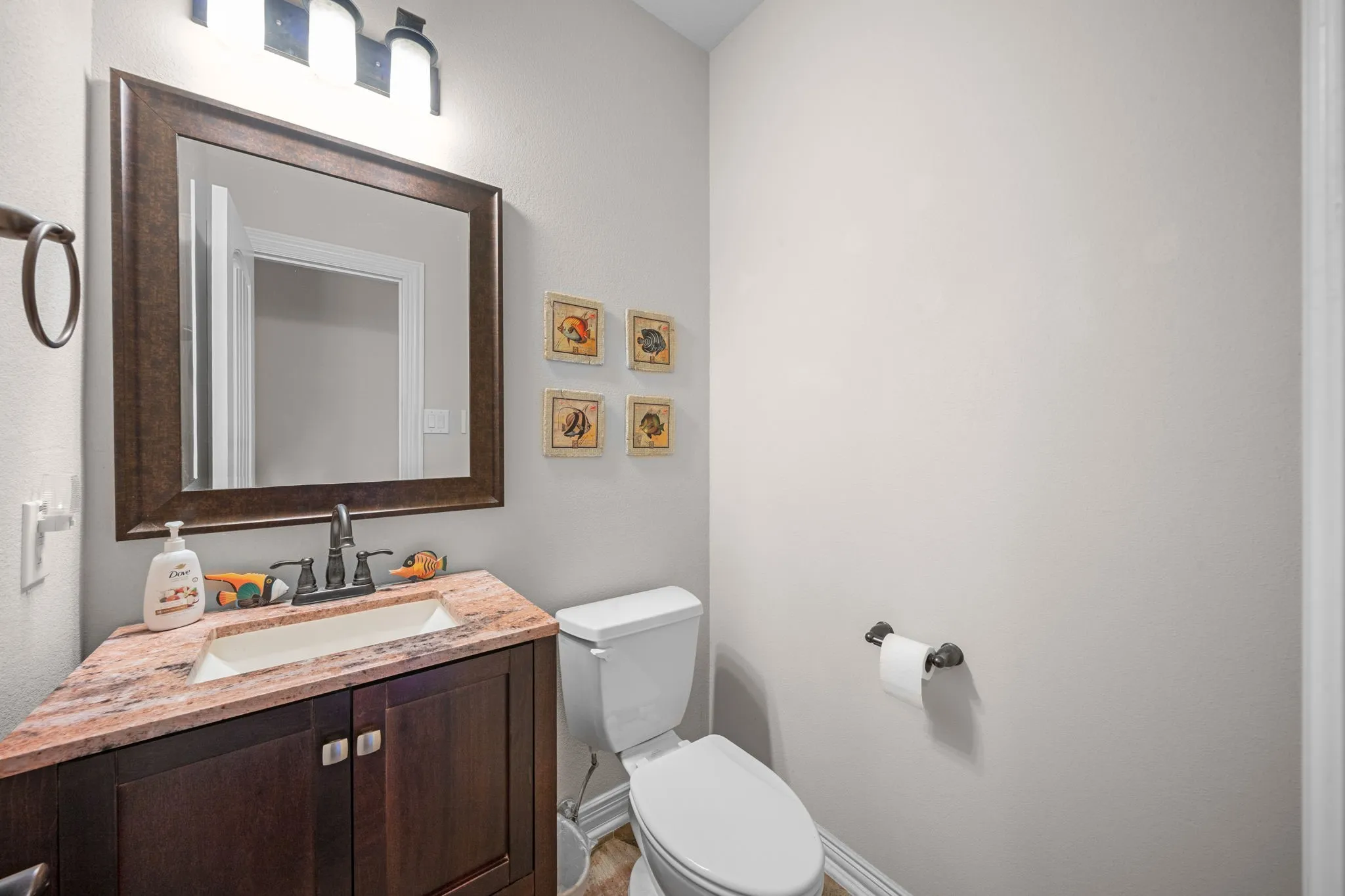Guest bath with beautiful granite vanity.