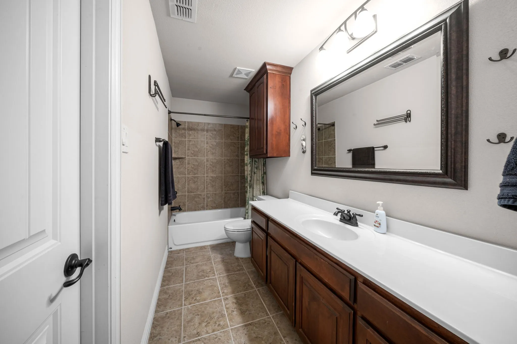 Jack and Jill bath with spacious vanity for secondary bedrooms.