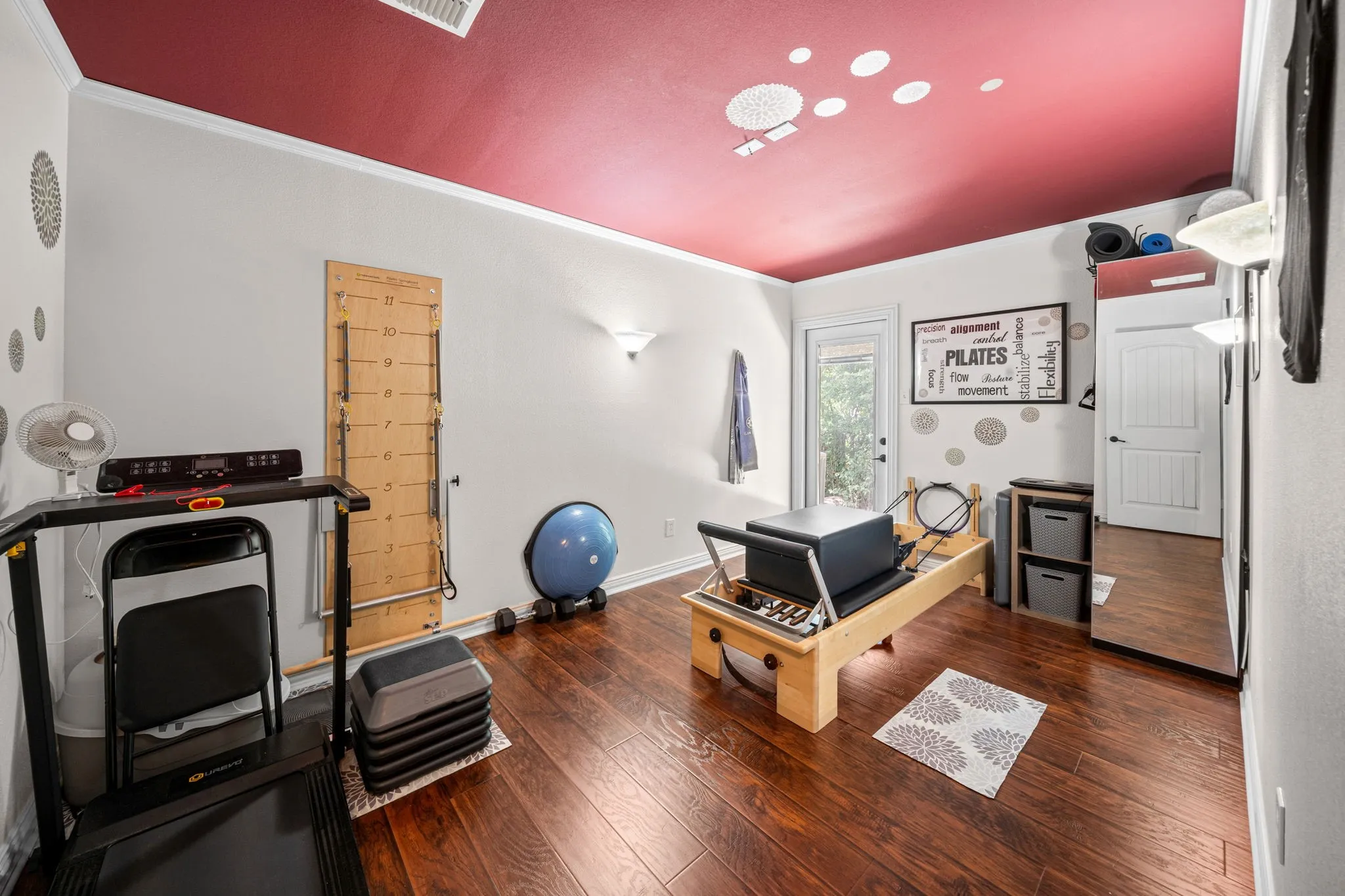 Bonus room with engineered wood floors is perfect for a home office or a gym.