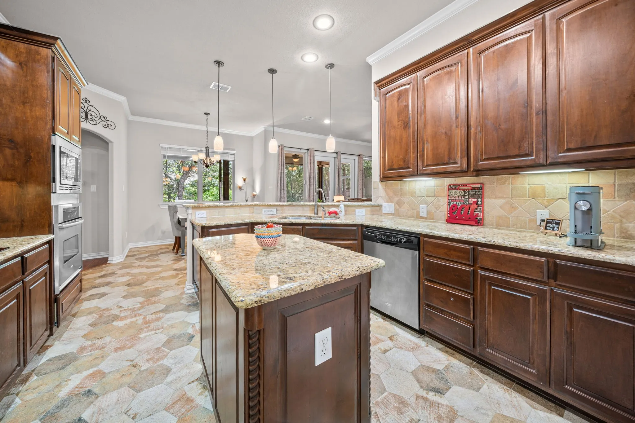 Spacious kitchen with beautiful granite countertops is open to the Breakfast area.