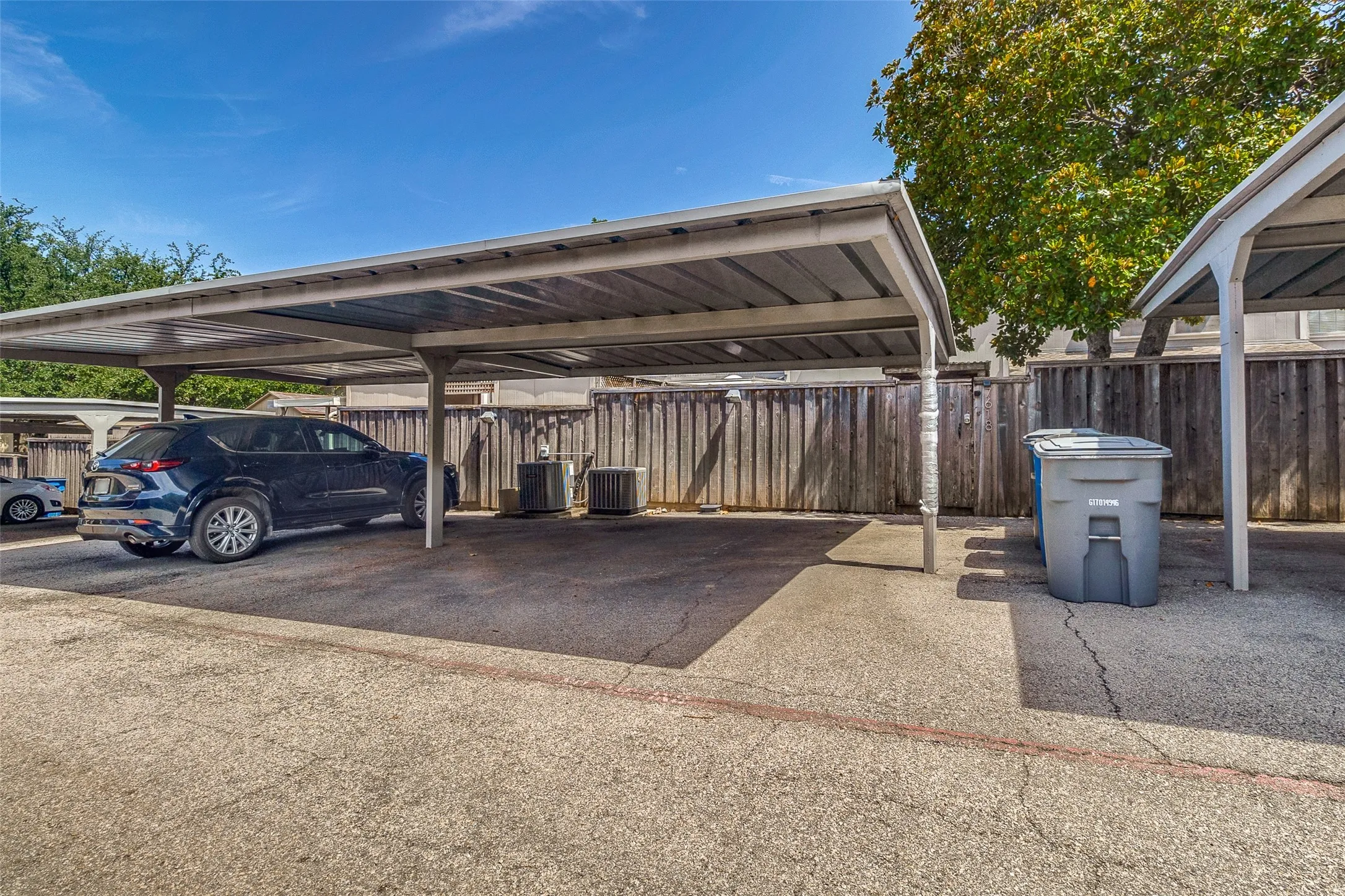 Fully Gated Parking - Two Carport Spaces Off Backyard