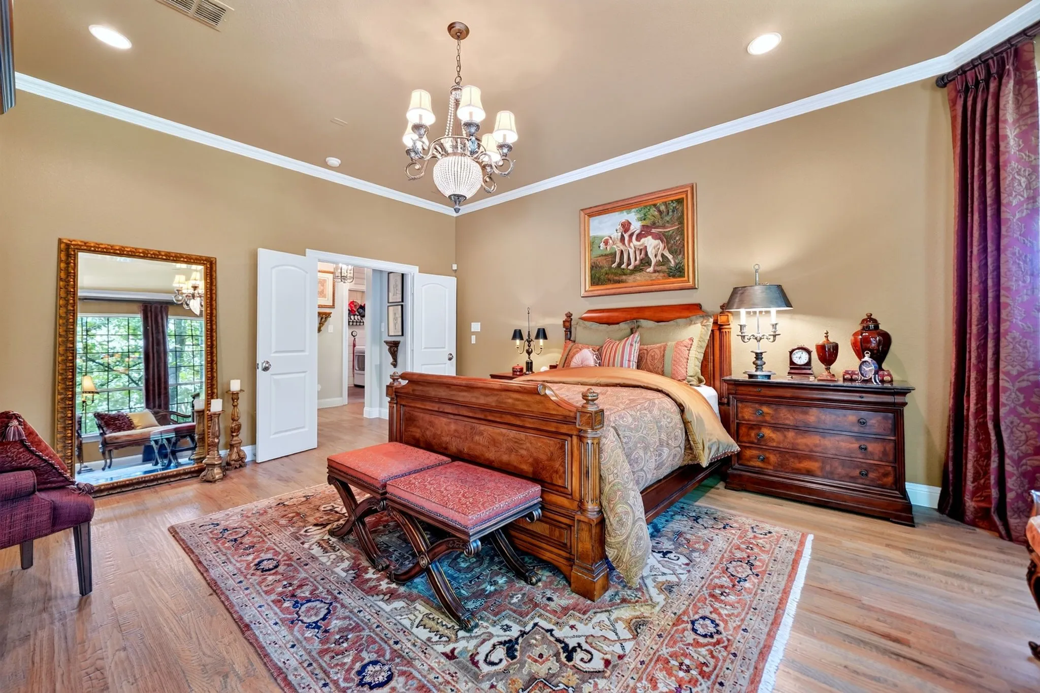 Spacious room featuring wood-finish flooring, recessed lighting, and crown molding