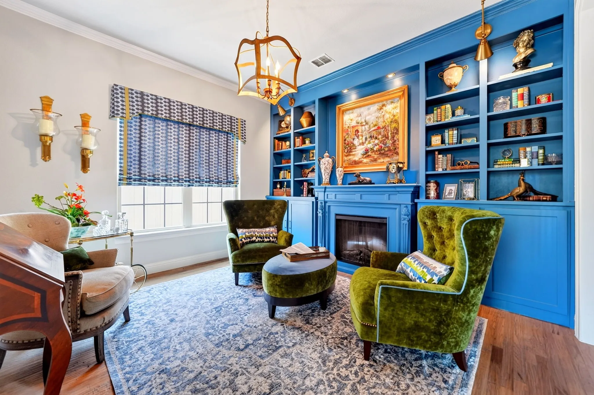 Built-in blue shelving unit featuring a decorative fireplace surround
