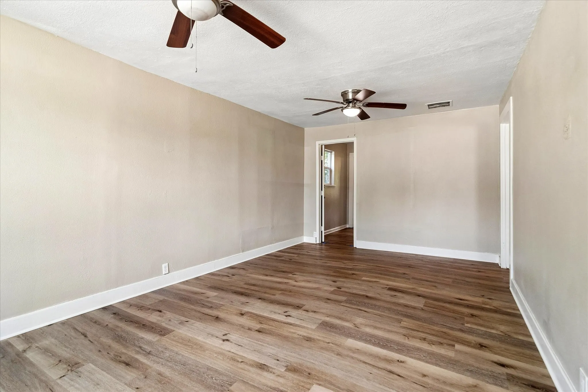 Door to the left is to a walk in closet, that also connects to the primary bedroom. Door to the right connects to a bedroom