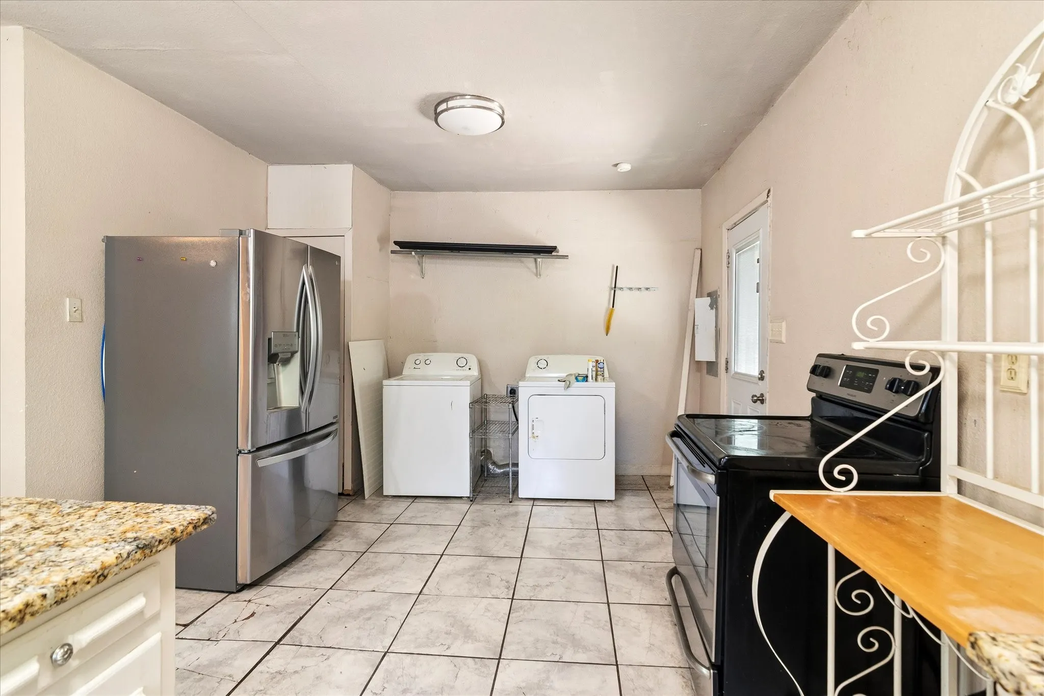 With laundry to the side of the kitchen