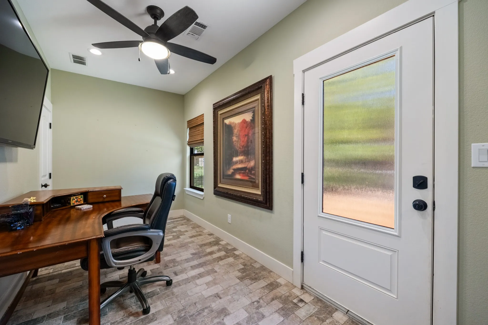 Recessed lighting, ceiling fan, wood-finish flooring, white trim, and a door with an opaque glass panel