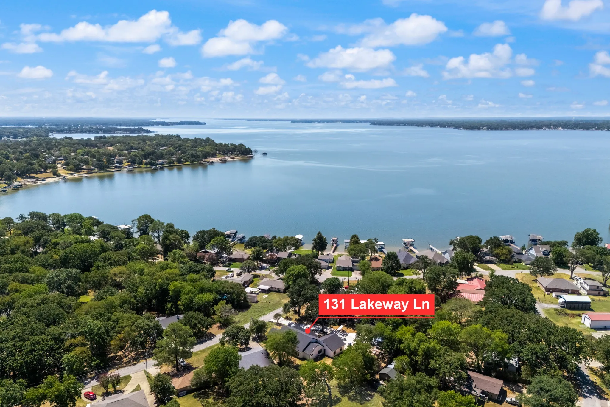 Lakefront property with direct water access and a surrounding established neighborhood
