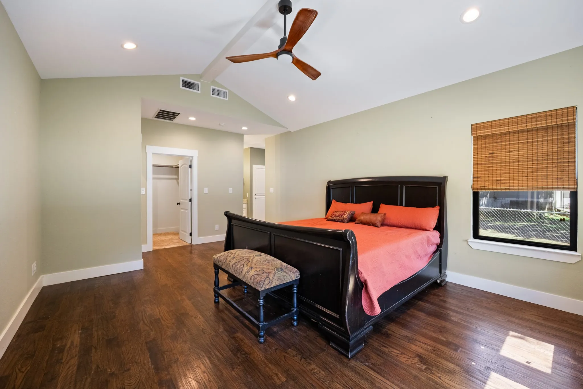 Vaulted ceiling with recessed lighting and a ceiling fan