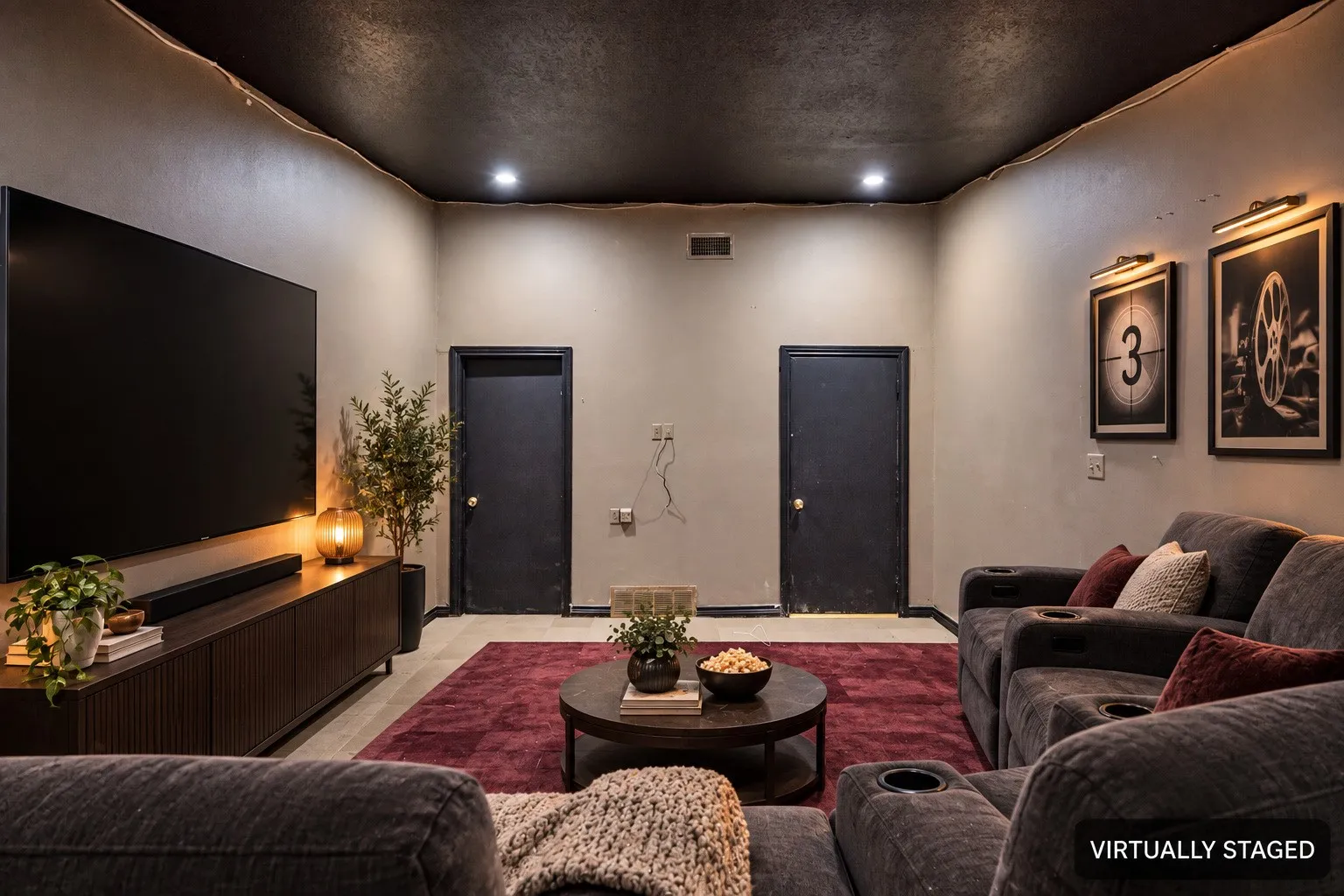 Recessed ceiling lighting, dark painted ceiling, light-colored walls, and two matching doors