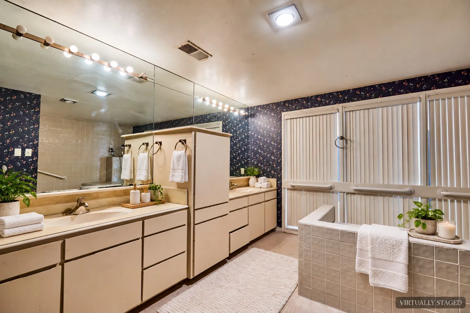 Dual vanity with integrated sinks and extensive storage cabinetry