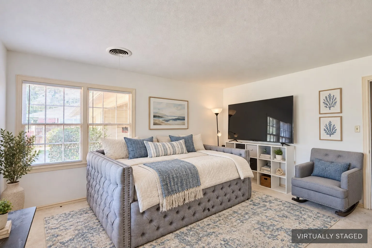 Recessed lighting, light-toned walls, and wood-finish window frames
