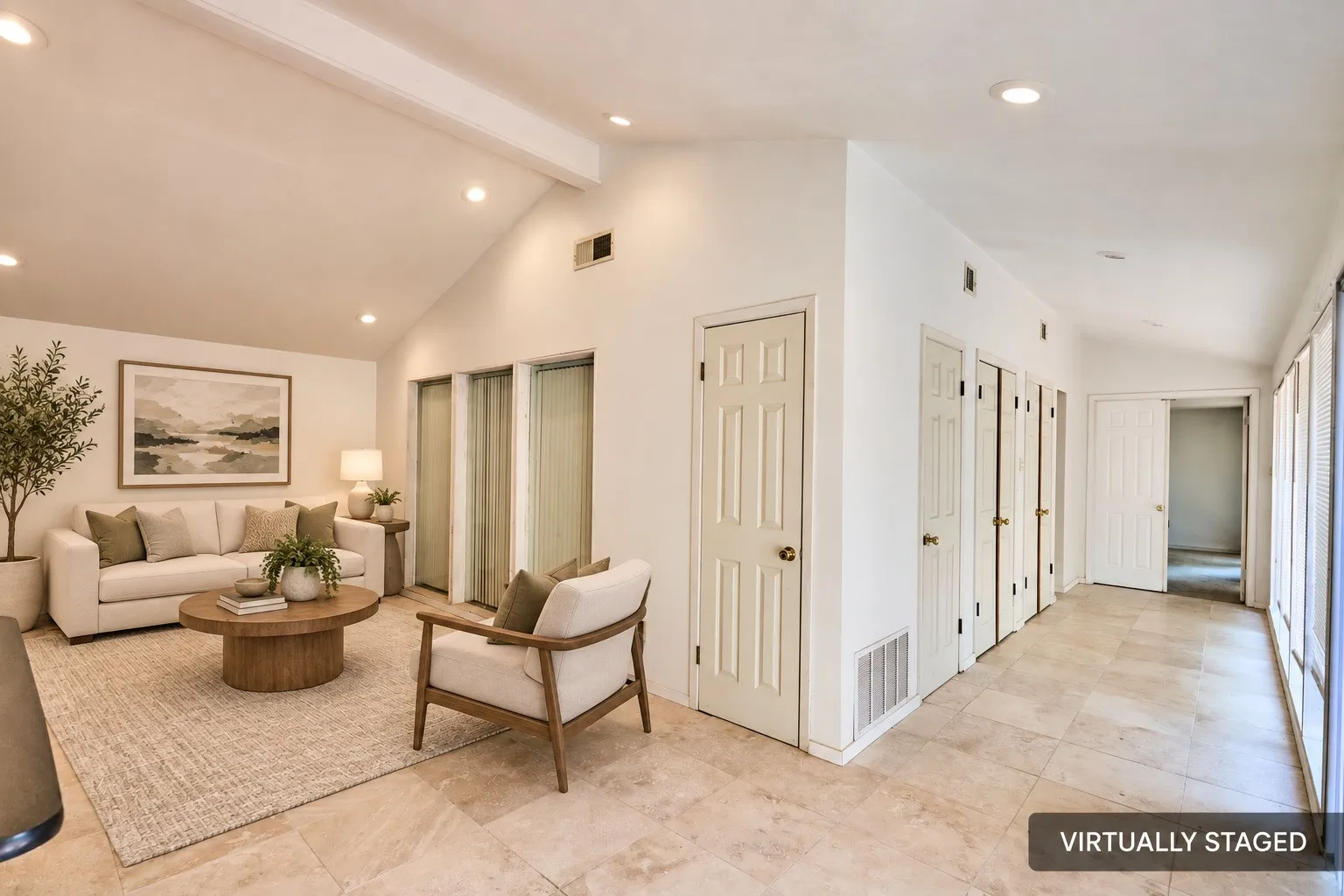 Vaulted ceilings with exposed beams, recessed lighting, tile flooring, and multiple interior doors