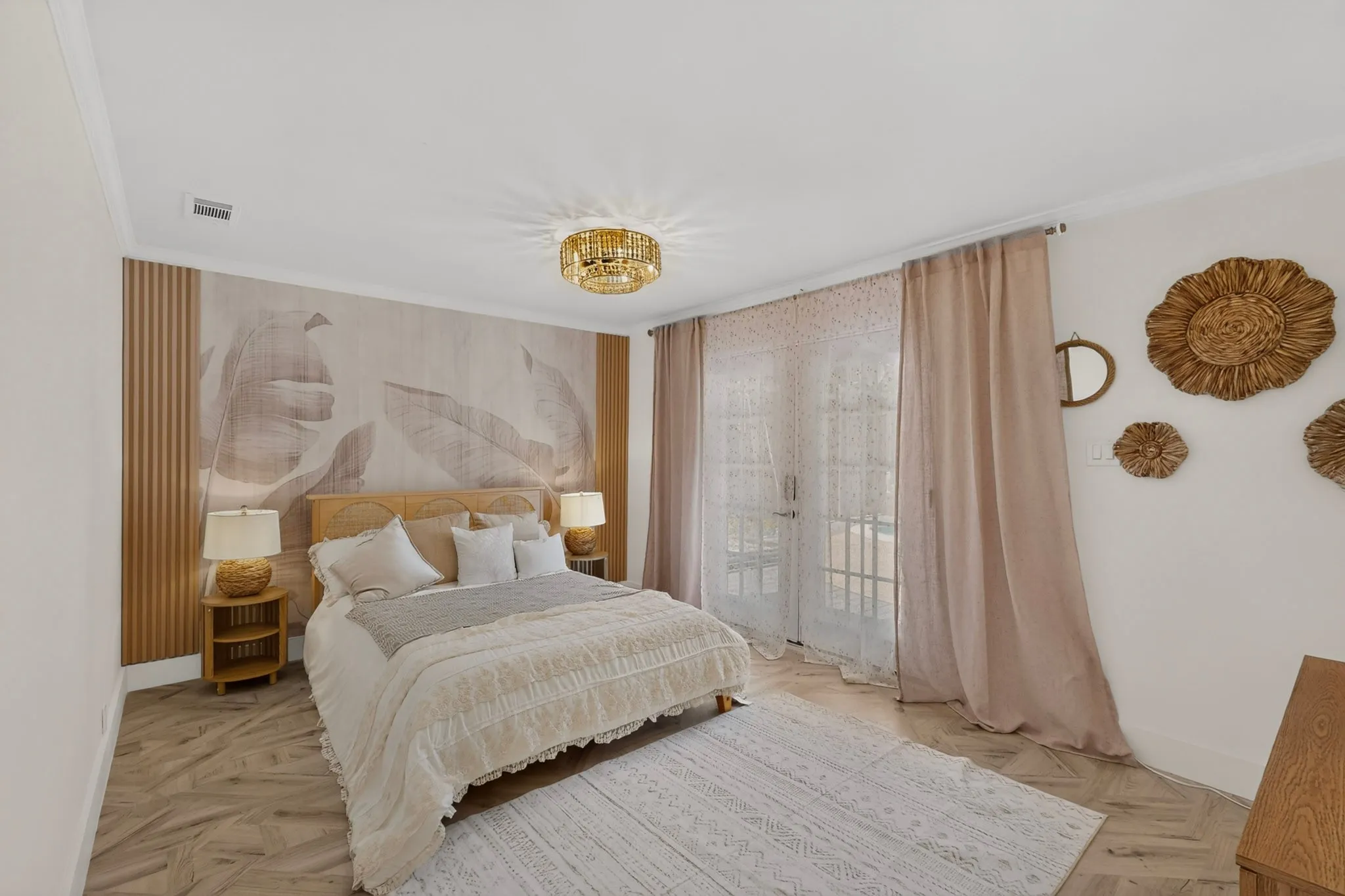 Bedroom featuring a decorative accent wall with wood paneling and botanical-patterned wallpaper