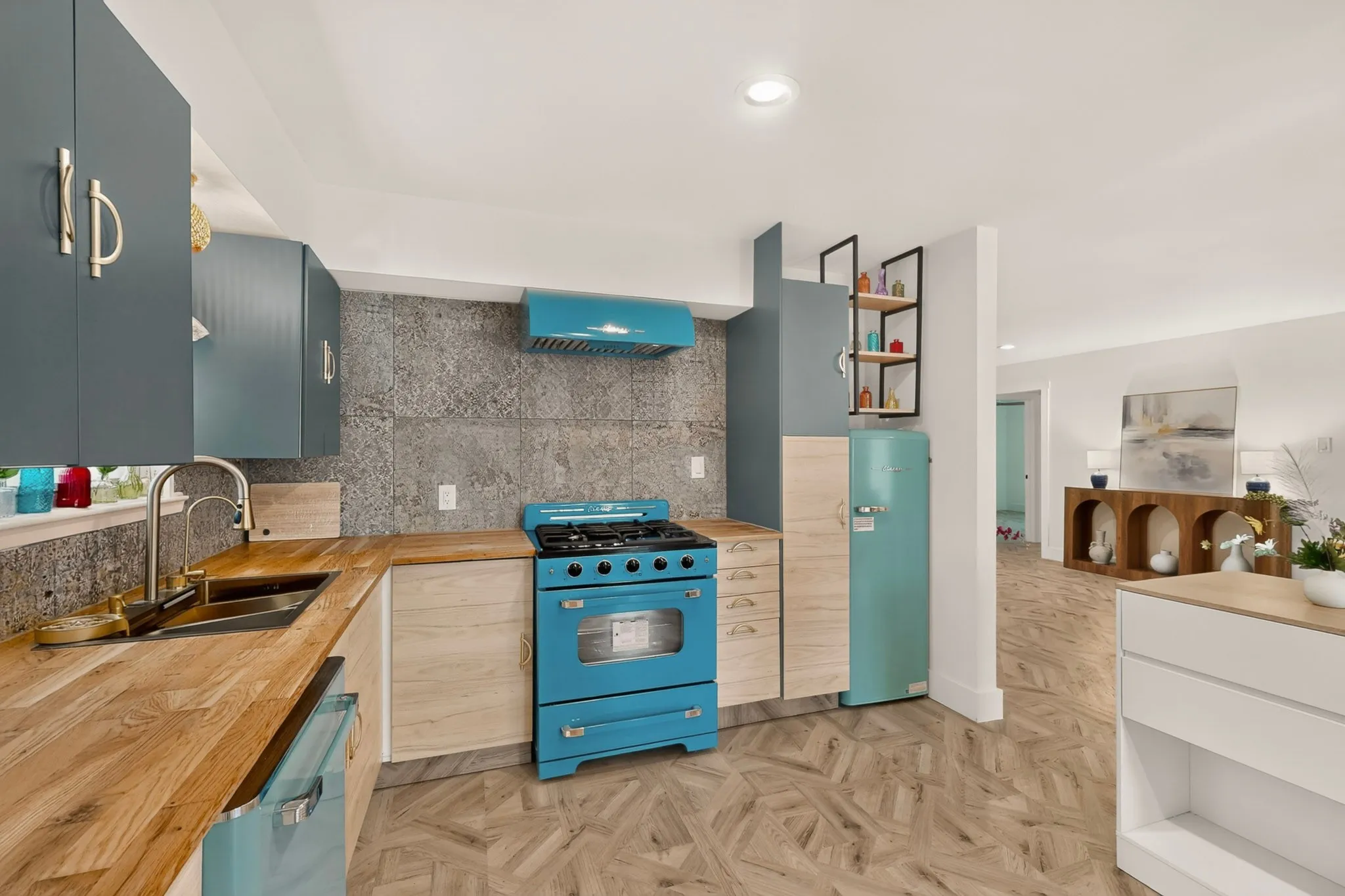 Kitchen featuring wood-finish countertops, blue cabinetry, a patterned backsplash, and a blue range with matching hood