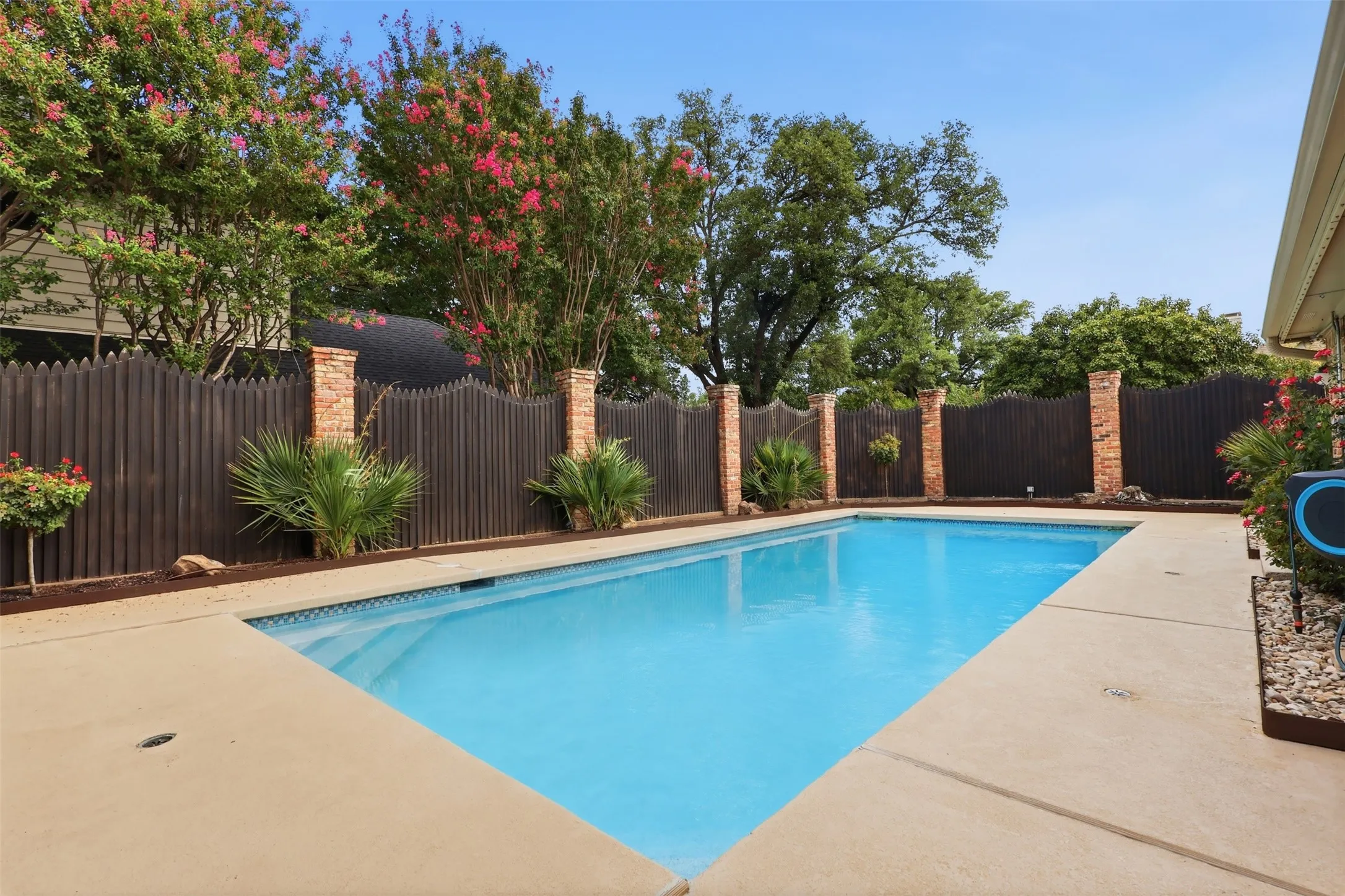 Rectangular swimming pool with concrete decking