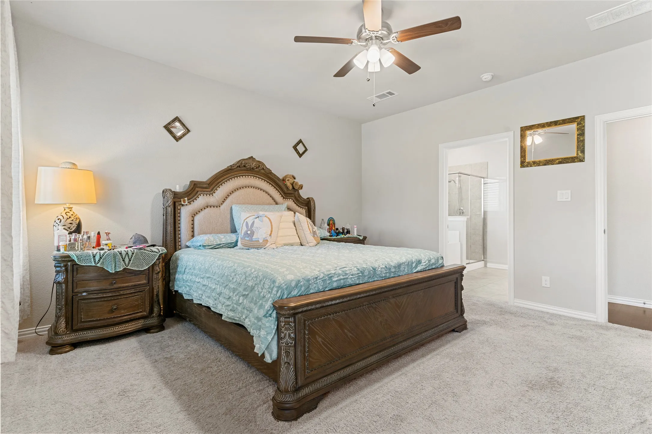 Carpeted room featuring a ceiling fan with integrated lighting, a recessed window, and neutral wall tones
