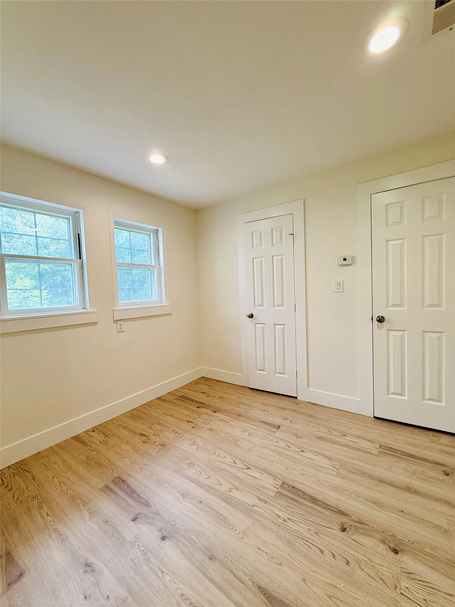 Office area with closets, could be additional bedroom