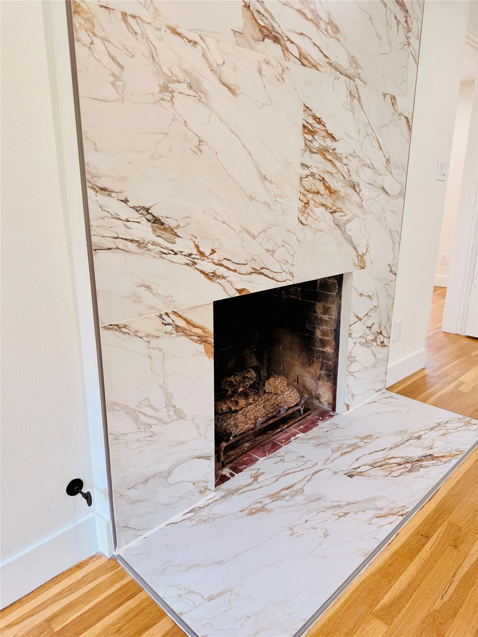 Gas burning fireplace in upstairs primary bedroom