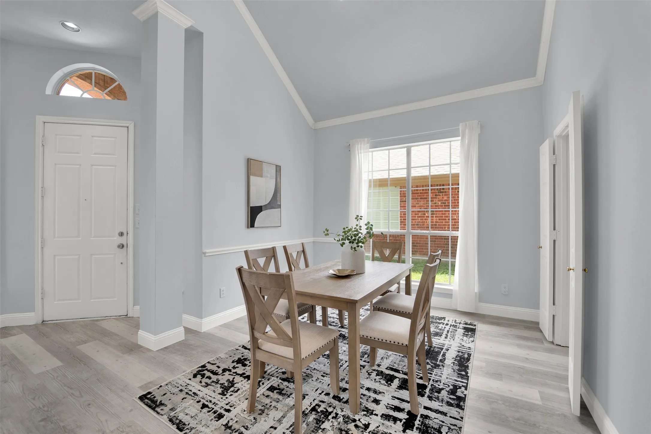 Vaulted ceiling with white crown molding