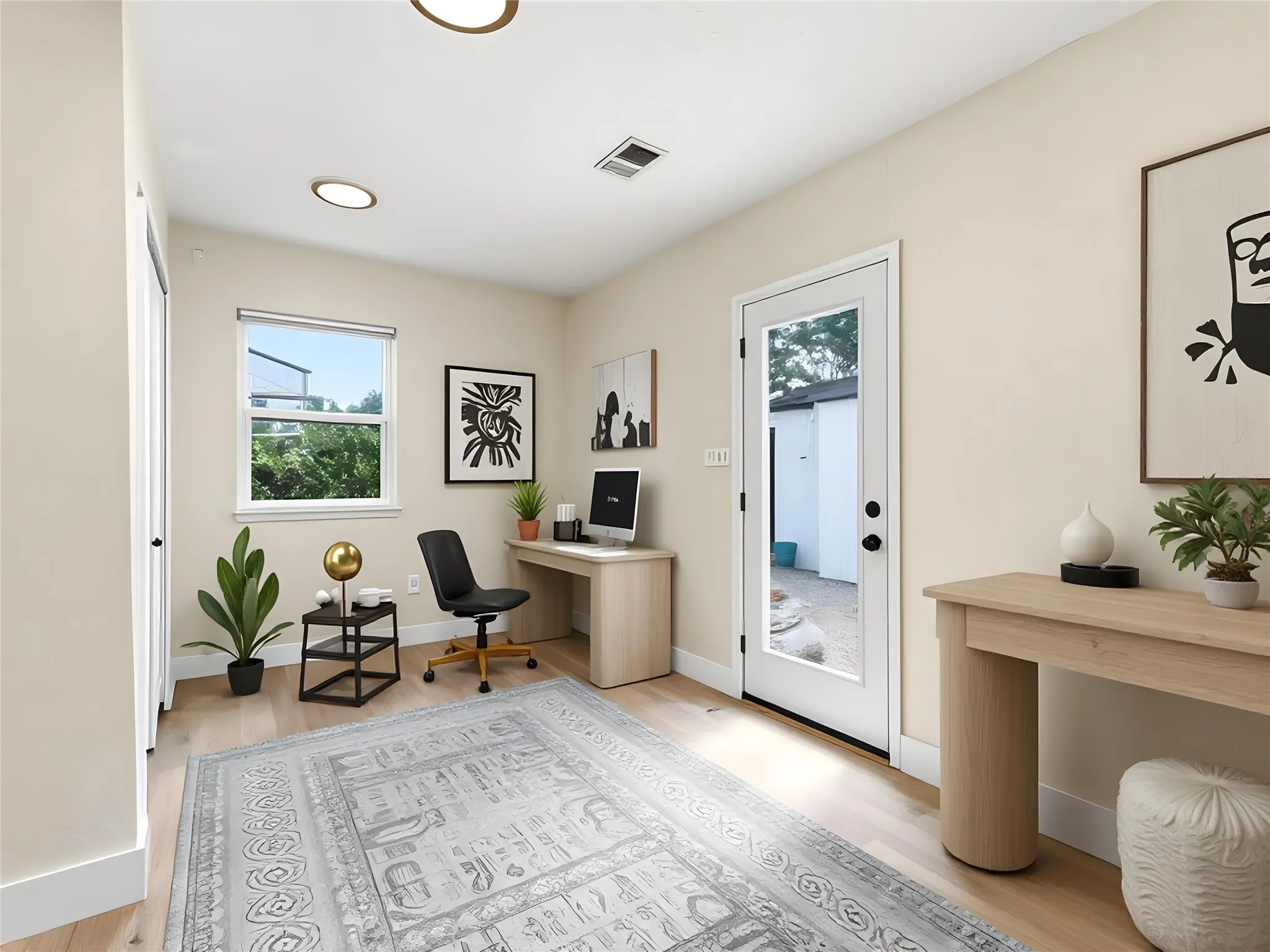 Light-filled room featuring wood-finish flooring, recessed lighting, and a white framed window