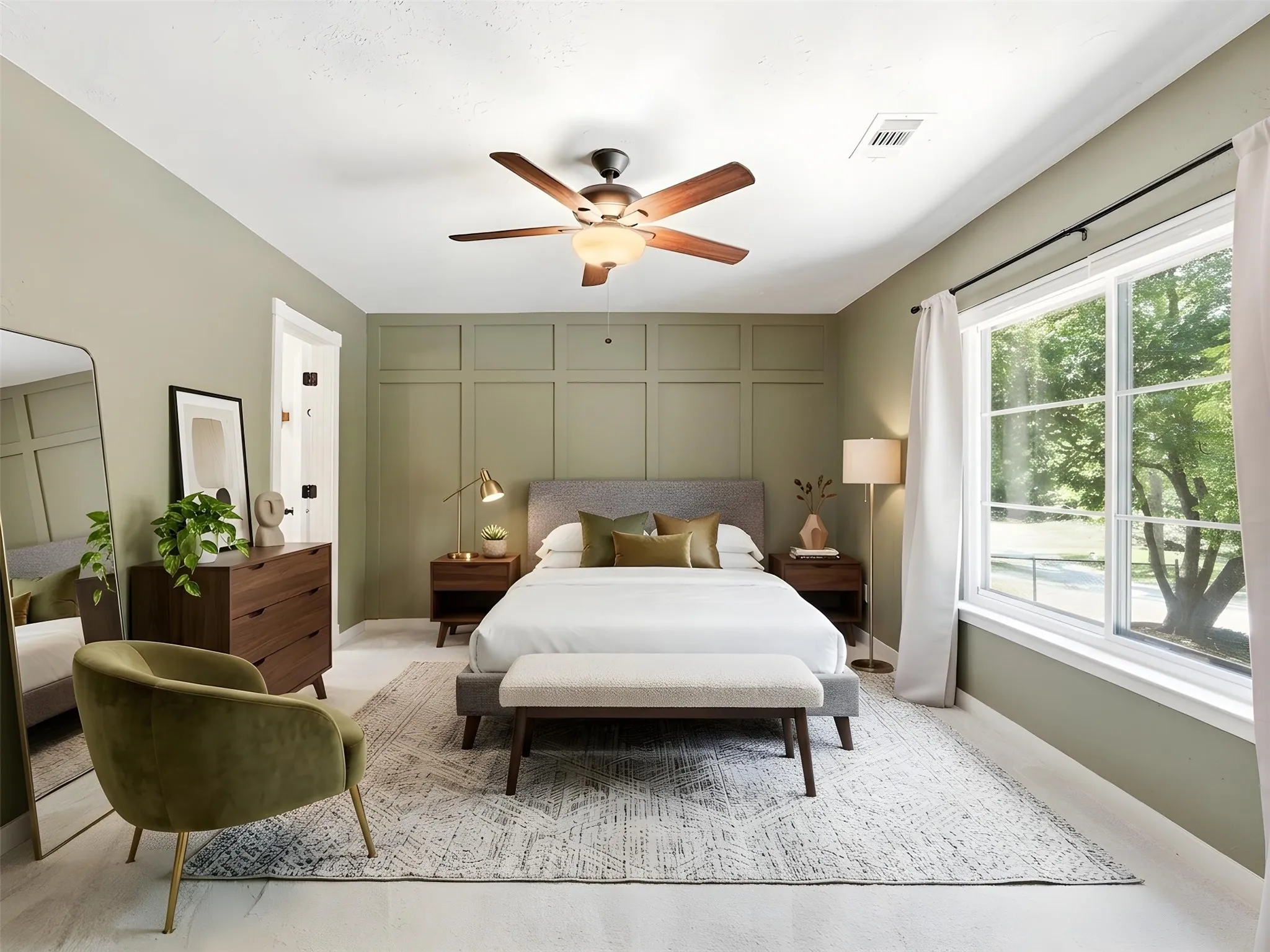 Bedroom featuring a paneled accent wall, a multi-pane window, and a ceiling fan with integrated lighting
