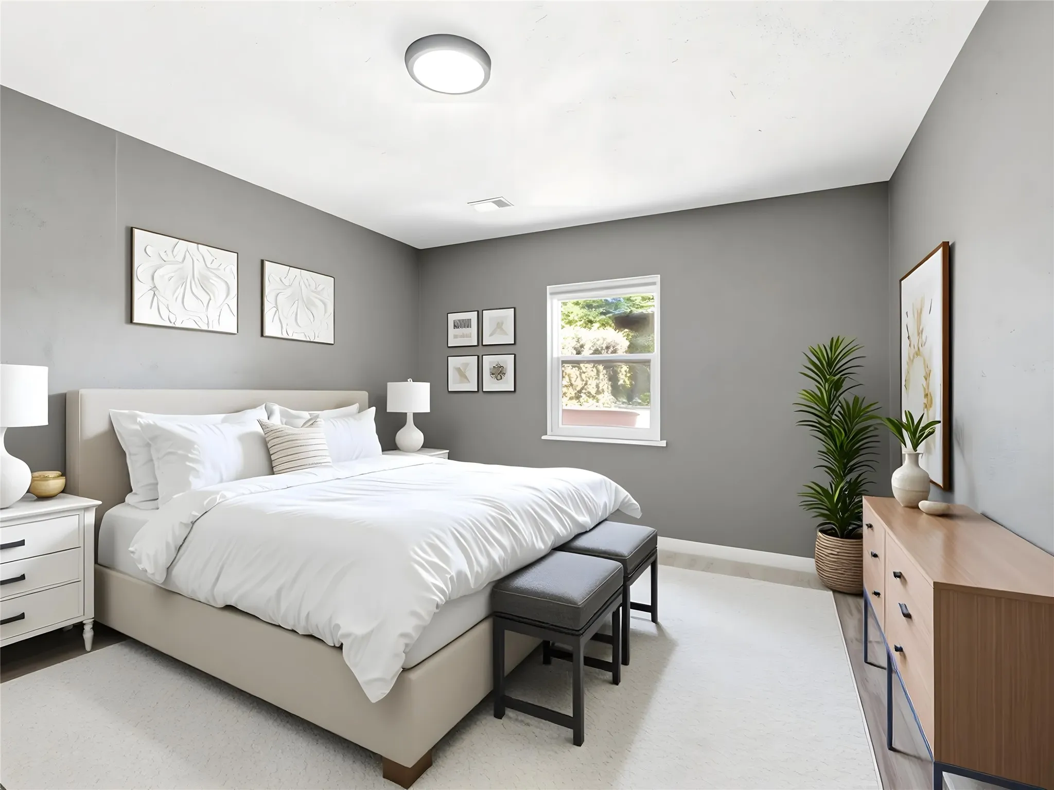 Spacious room with light gray walls and a single window offering natural illumination