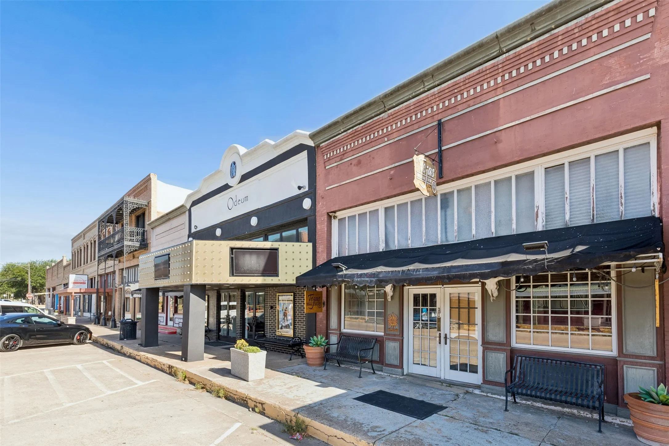 Commercial storefront with double entry doors and a retractable awning
