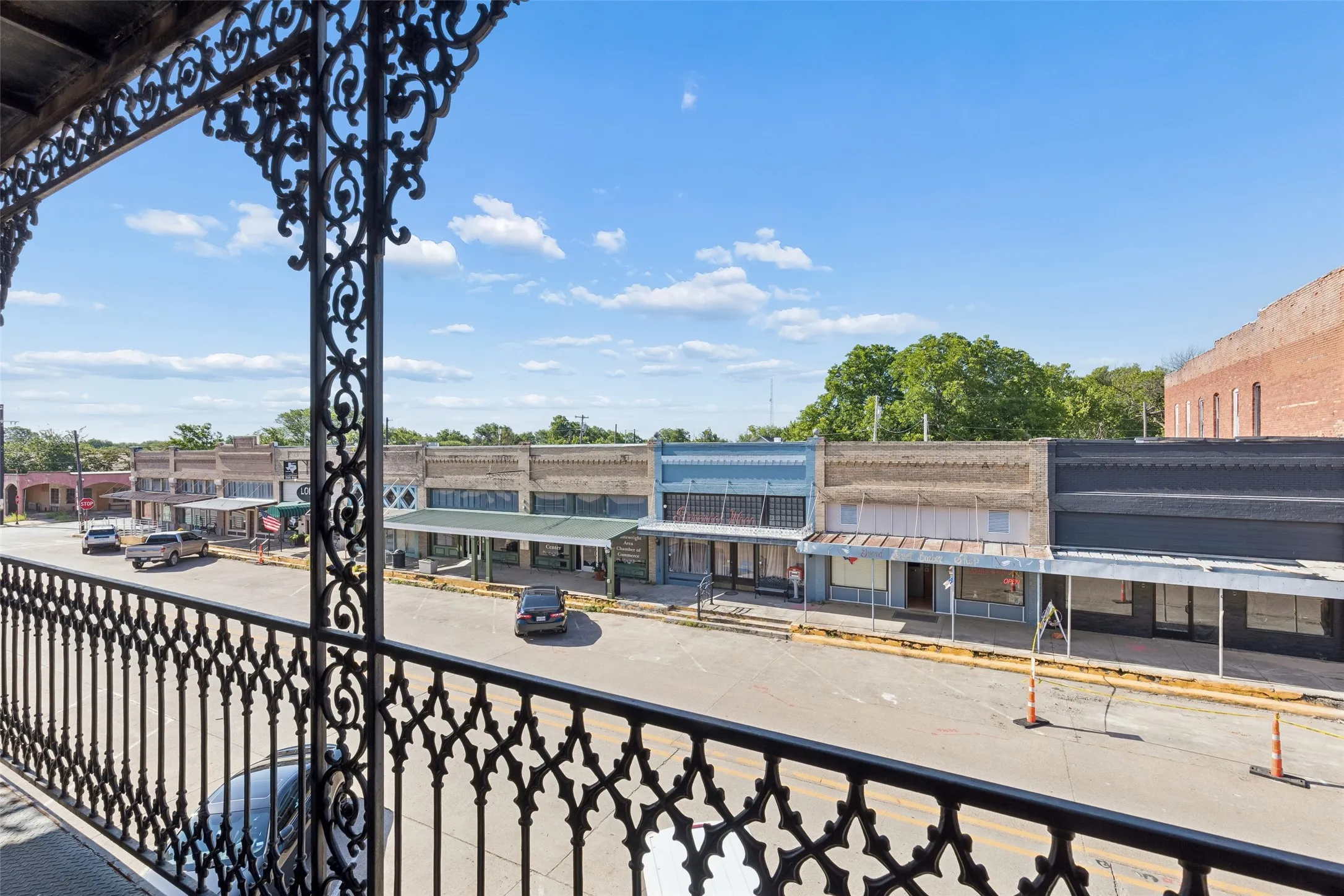 Balcony with ornate black wrought iron railings