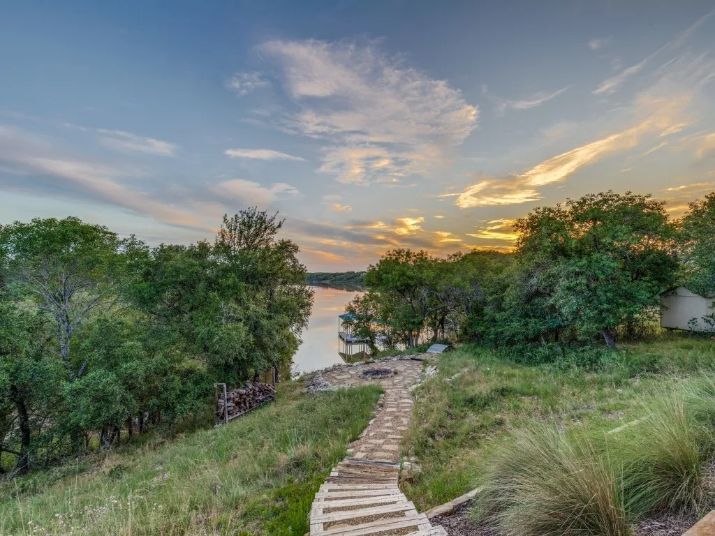 Walkway down to the fire pit, water & dock