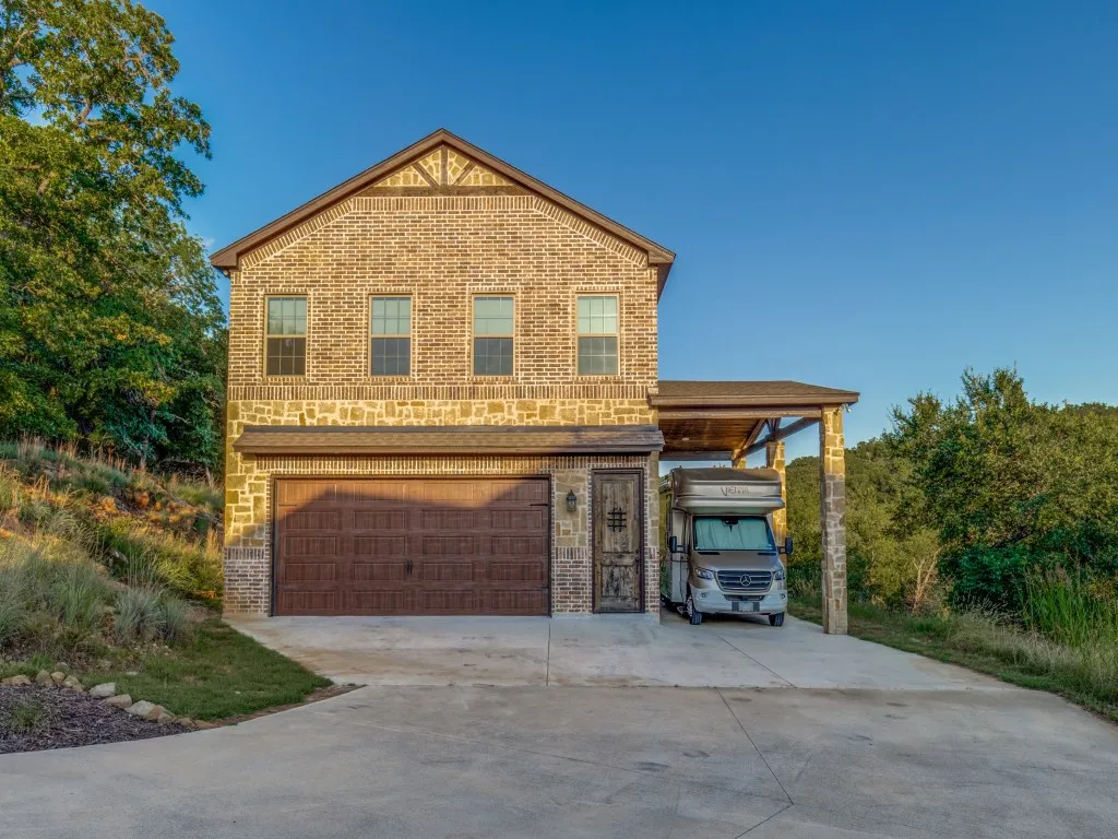 Secondary garage with ADU apartment upstairs with covered RV parking.