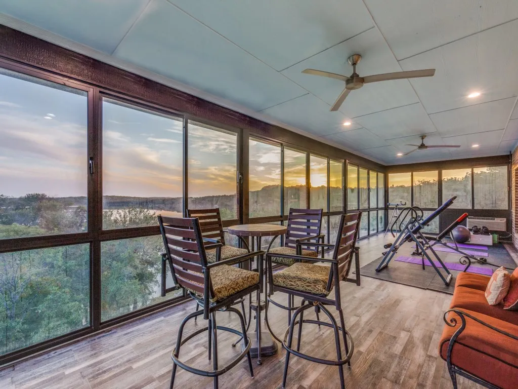 Sliding glass enclosed sunroom deck upstairs on the main house.