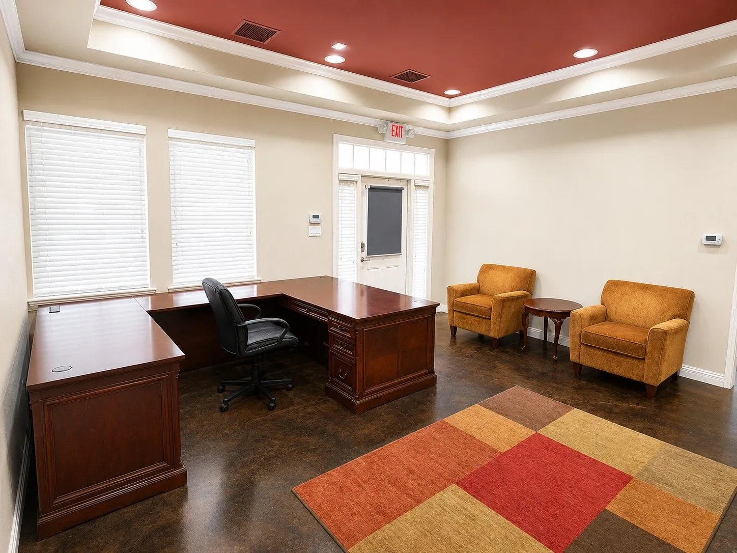 Spacious room featuring a decorative tray ceiling with recessed lighting, crown molding, two large windows with blinds, and dark-toned flooring