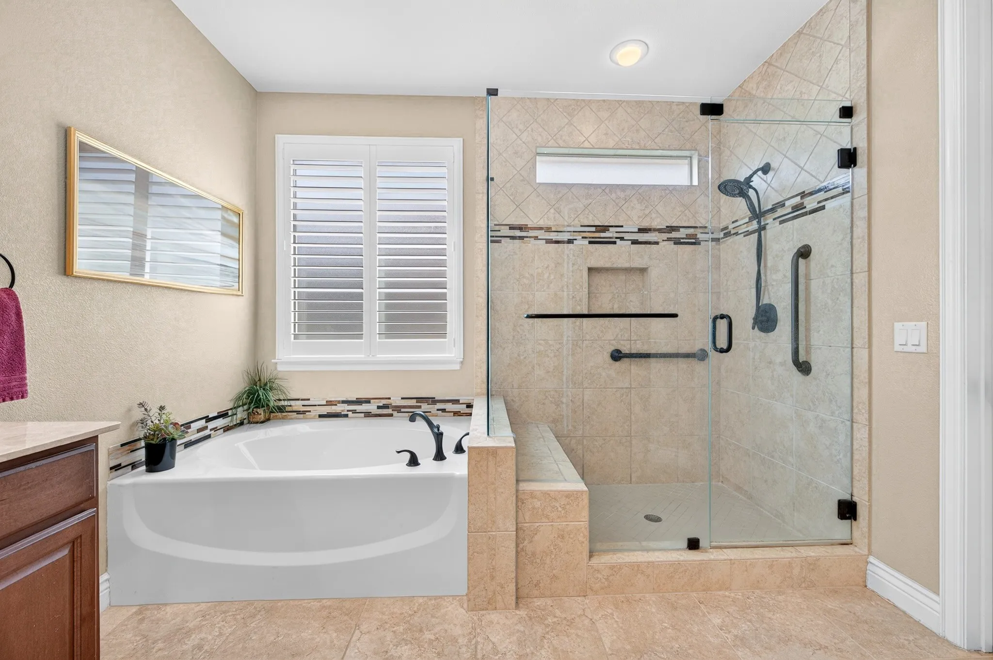 Terrific frameless shower and garden tub.
