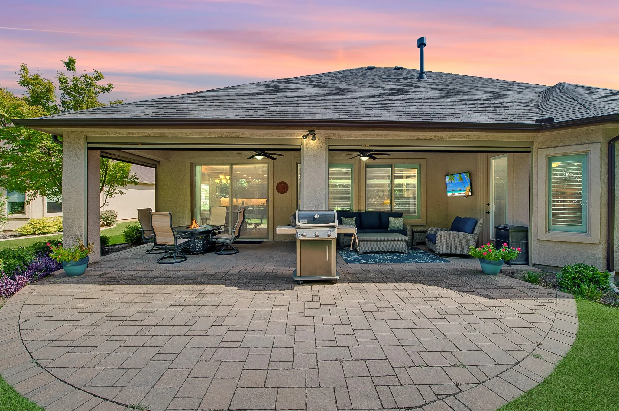 The back covered porch leads onto and extended patio.