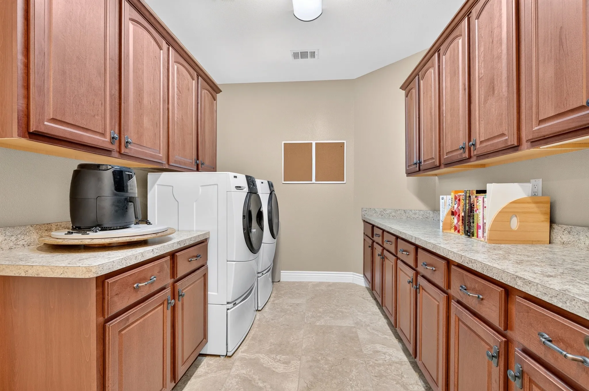 Check out all the storage in this large utility room.