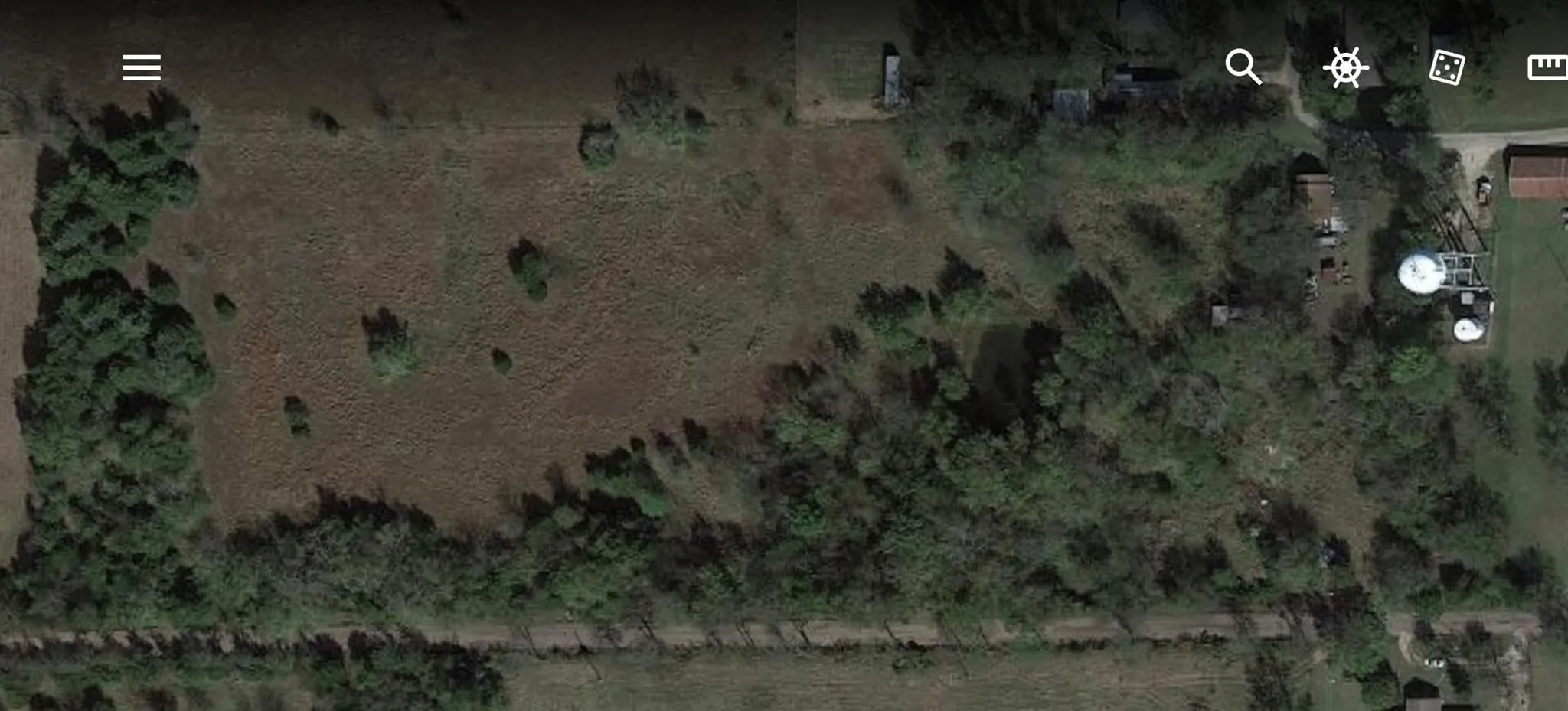 Aerial view of property's location with rural landscape