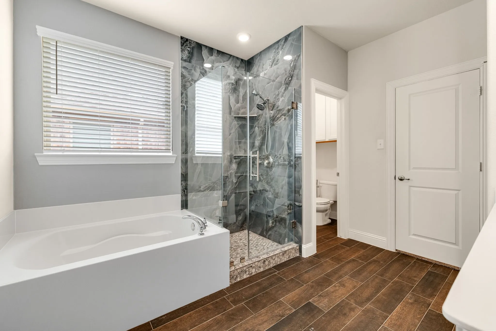 Renovated Shower, Deep Soaking Tub, Double sinks, Built-in shelves, Luxury Tile Flooring