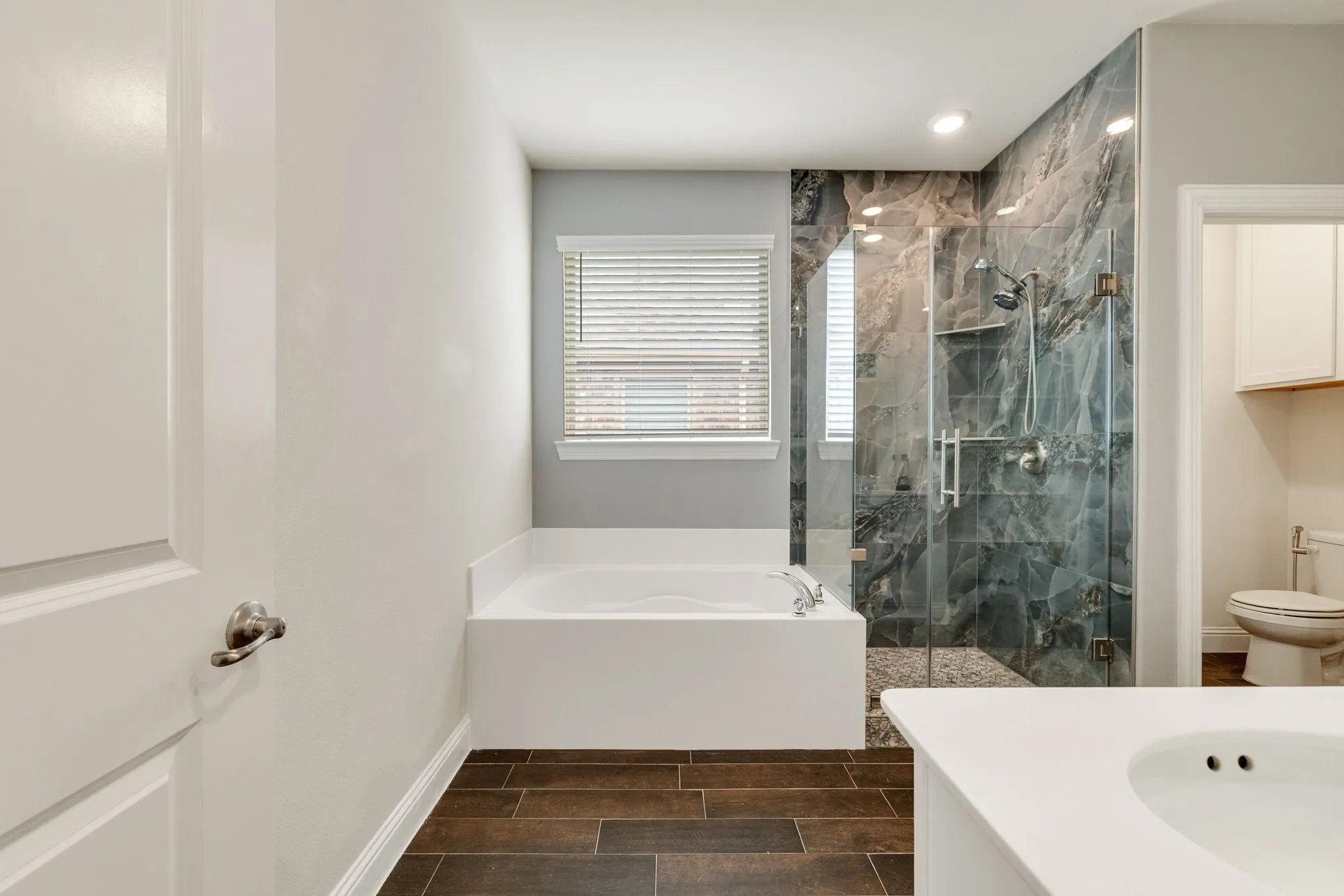 Renovated Shower, Deep Soaking Tub, Double sinks, Built-in shelves, Luxury Tile Flooring