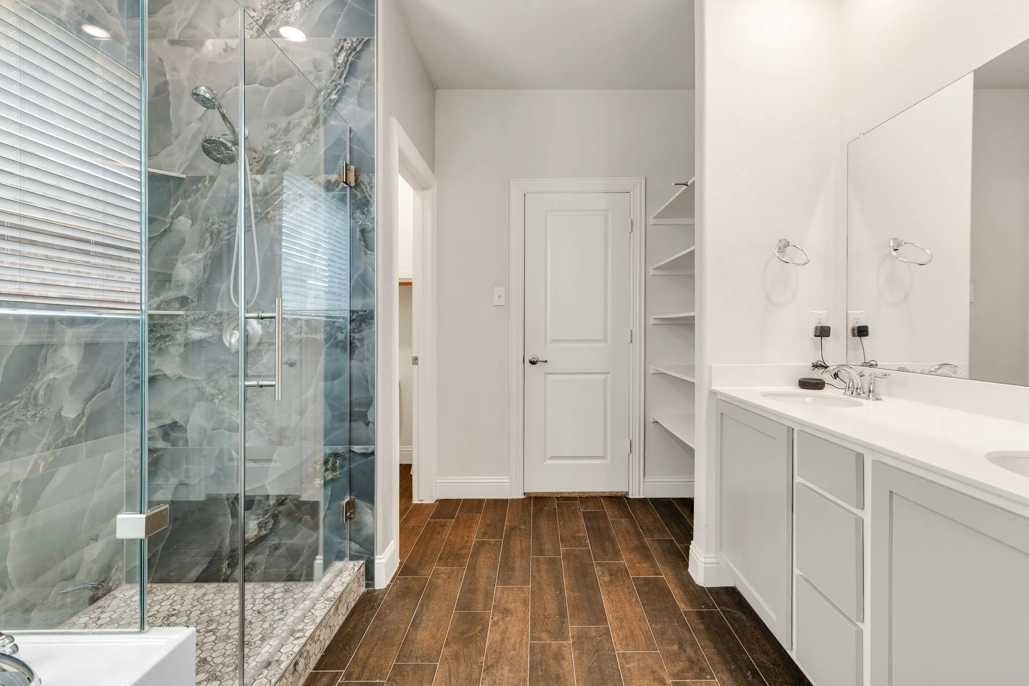 Renovated Shower, Deep Soaking Tub, Double sinks, Built-in shelves, Luxury Tile Flooring