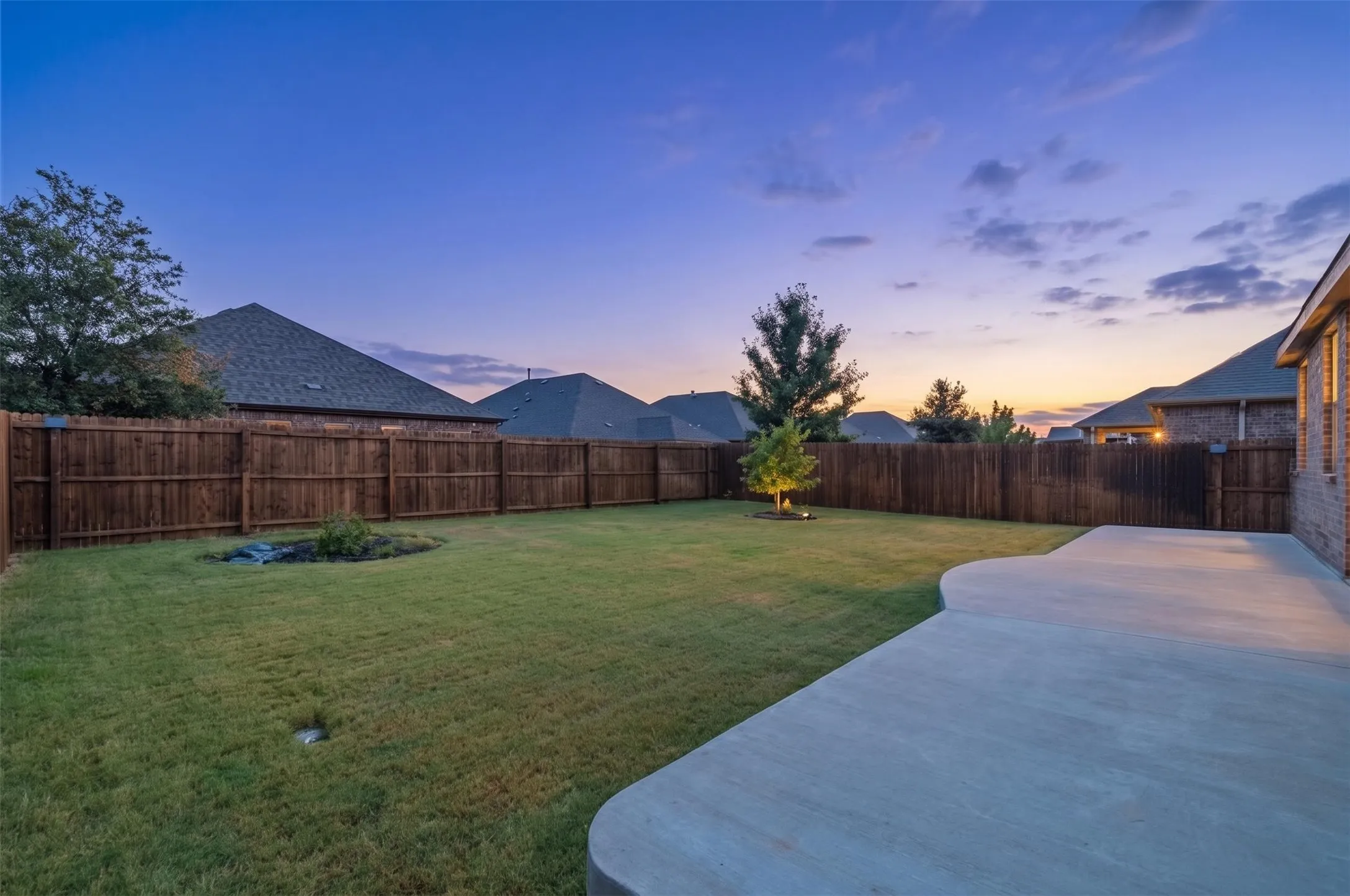 Newly stained fencing and extended uncovered patio! Great canvas for adding a pool or your own outdoor entertaining oasis!