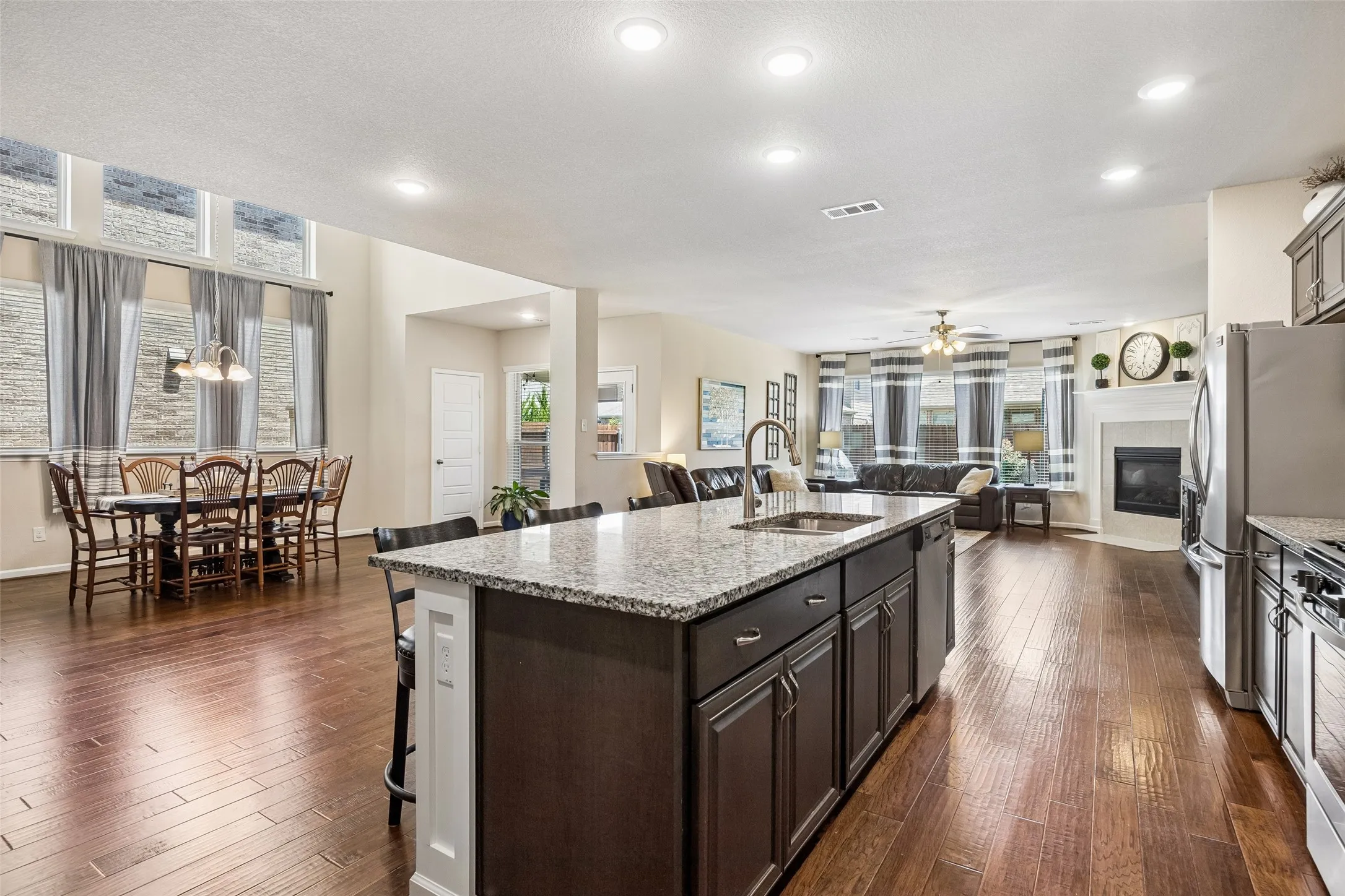 Looking into the open-concept living space featuring the kitchen, dining room and living room.