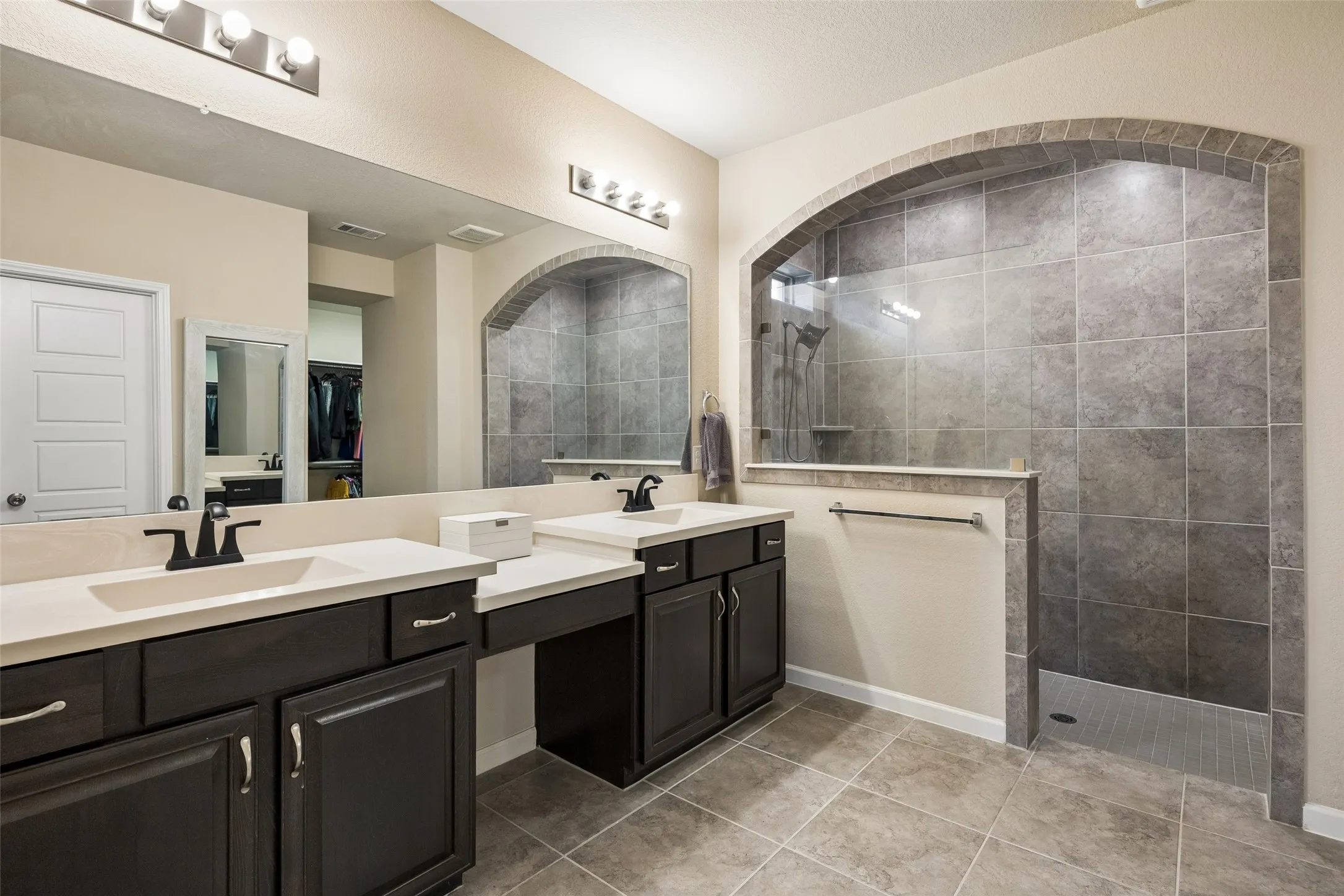 The ensuite praimary bathroom features an oversized walk in shower.